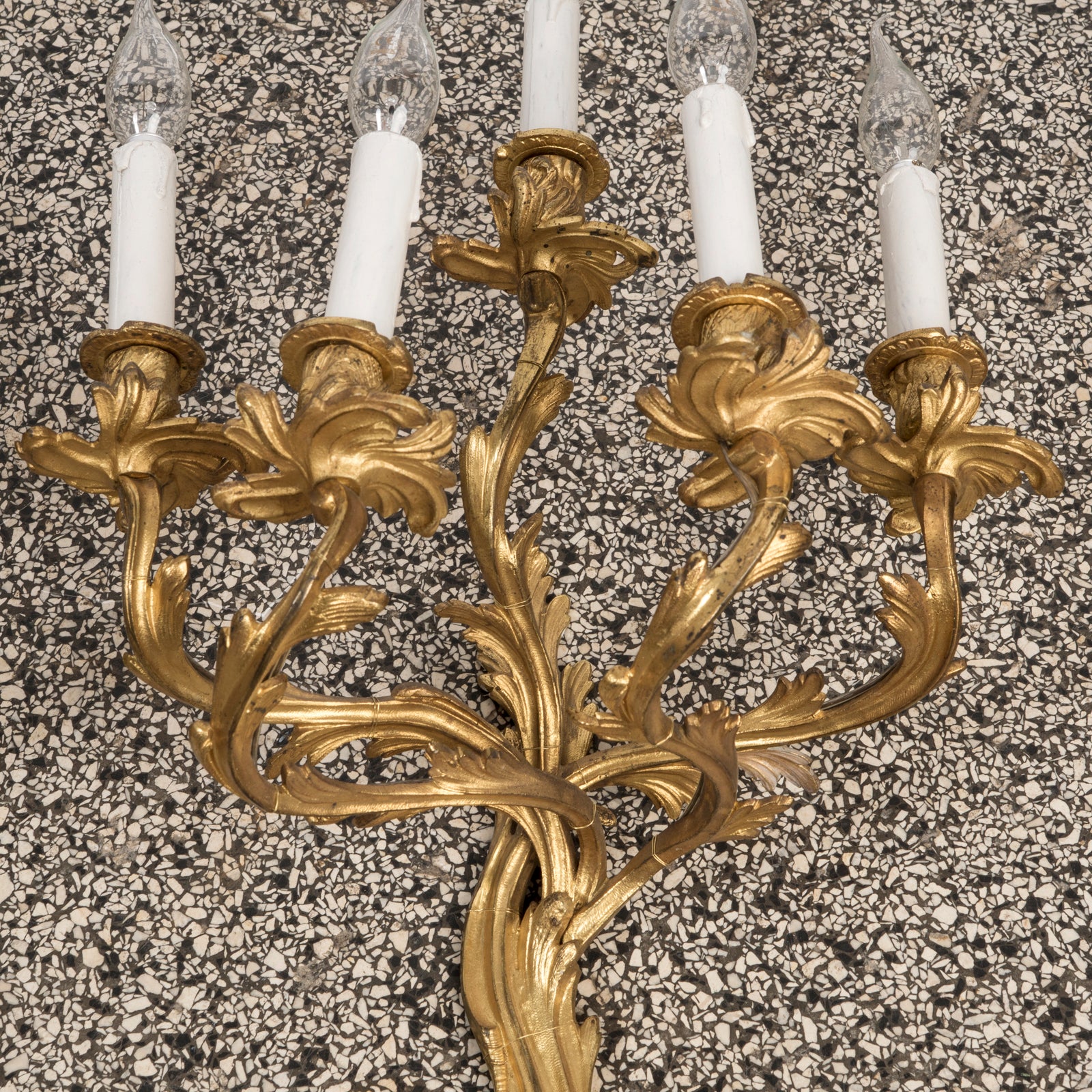 Close-up of a gand 19th-century French Rococo five-light sconce or wall light, crafted from richly gilded bronze