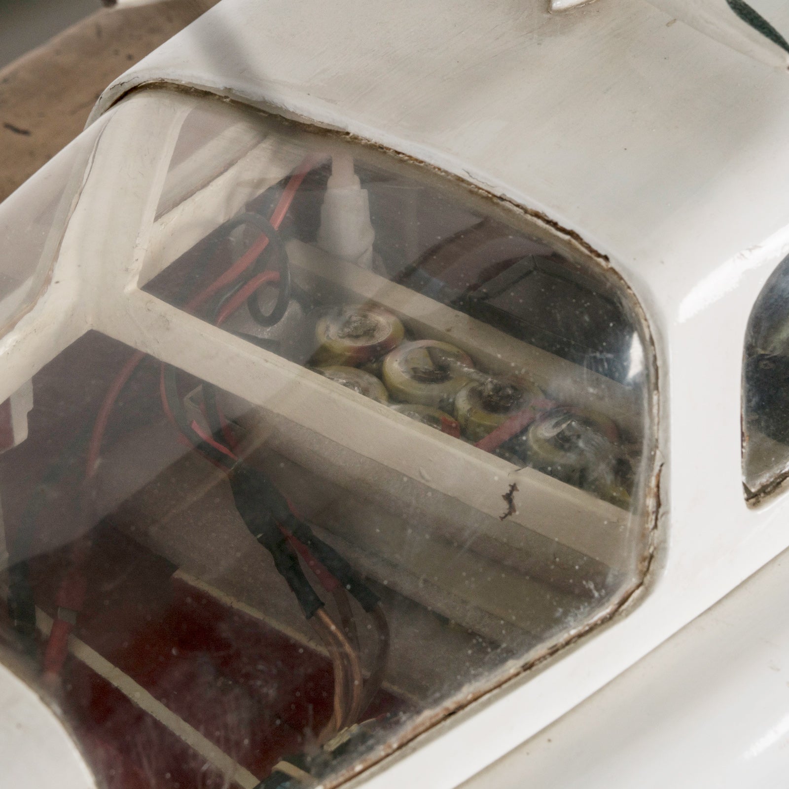 Close-up of a superb vintage French scale model of a speed boat, meticulously handcrafted to replicate the iconic Plymouth motorboat. Made from light-toned wood with fine detailing, this elegant piece captures nautical charm at its best. Available at Wildschut Antiques.