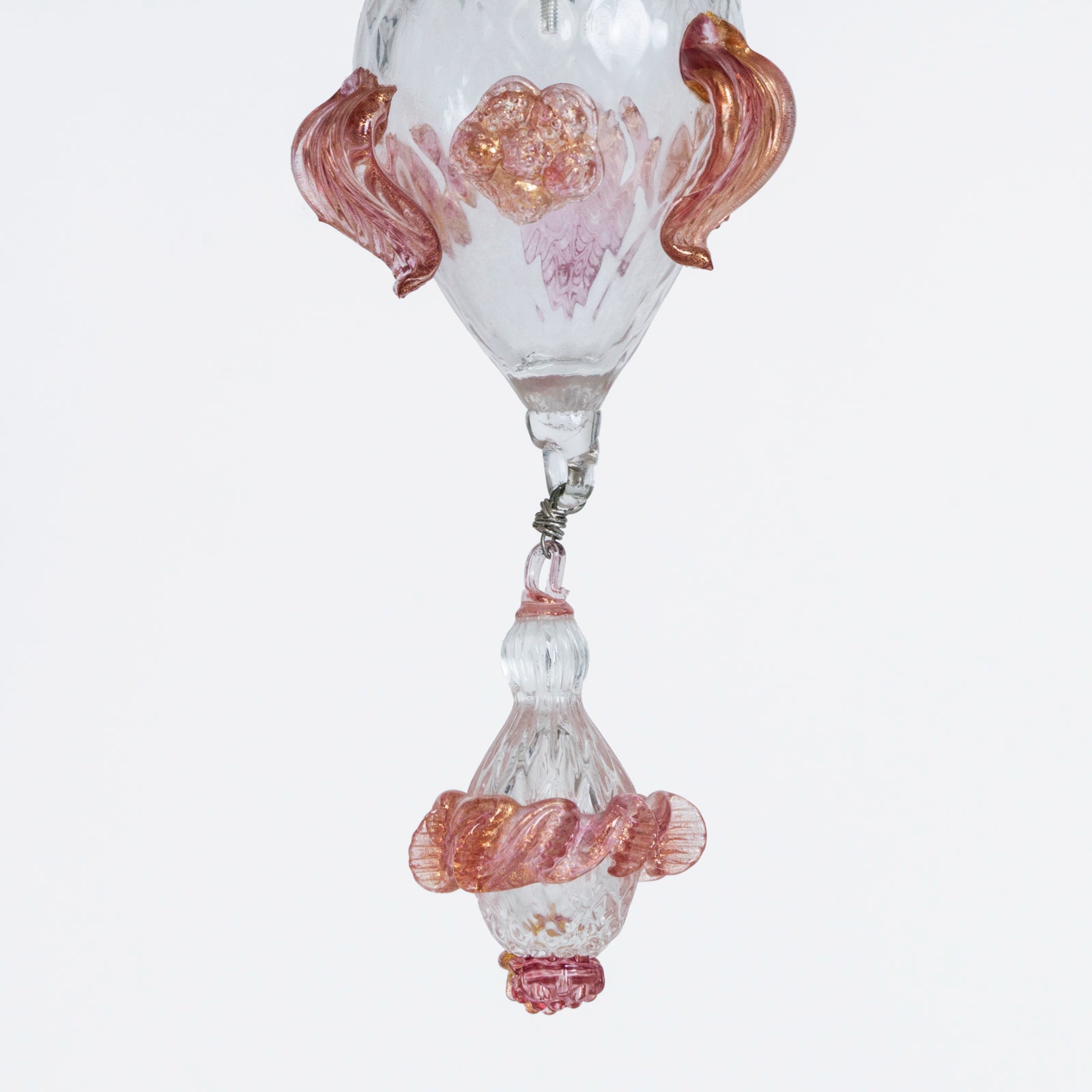 Close-up of the bottom part of a vintage Venetian Murano Glass 6-light chandelier with white glass and pink floral details, featuring intricate craftsmanship, available at Wildschut Antiques