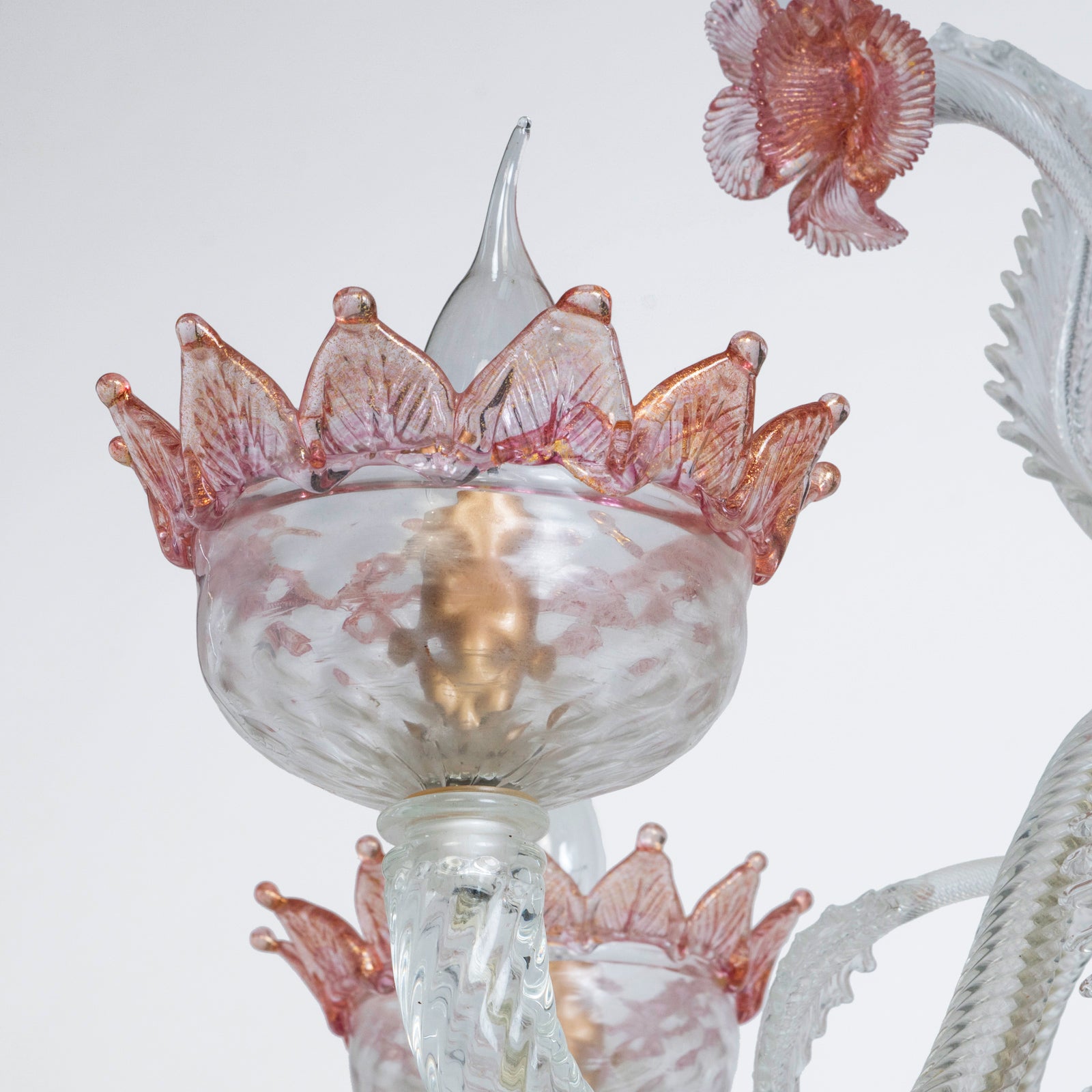 Close-up of a vintage Venetian Murano Glass 6-light chandelier with white glass and pink floral details, featuring intricate craftsmanship, available at Wildschut Antiques