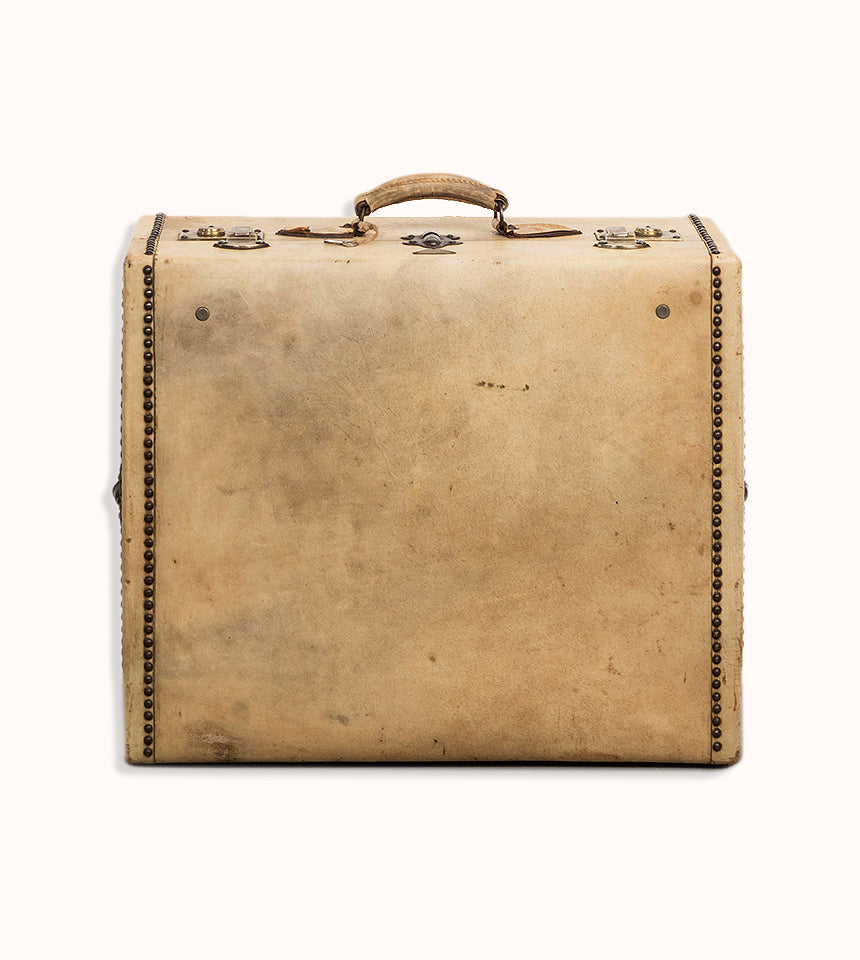 Vintage French cream leather suitcase with brass studs, leather handle, and a lock plate by Lavoet, available at Wildschut Antiques