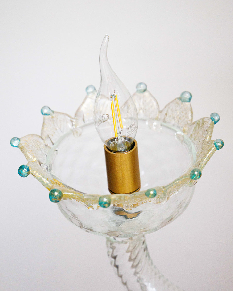 Close-up of a Venetian Murano glass 6-light chandelier with white glass and blue and gold details, featuring intricate floral patterns