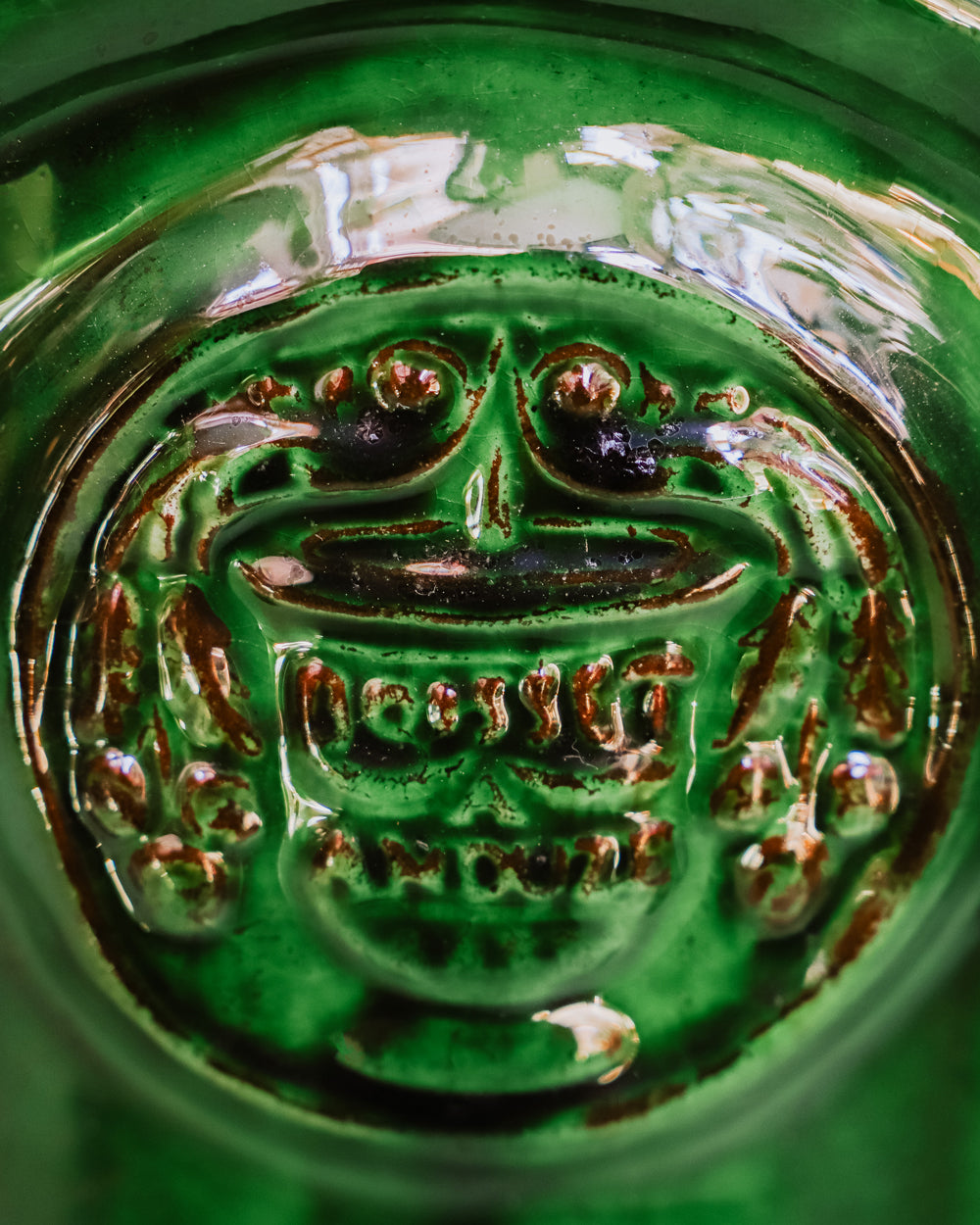 Close-up of a ceramic Anduze jar or pot in emerald green, available at Wildschut Antiques