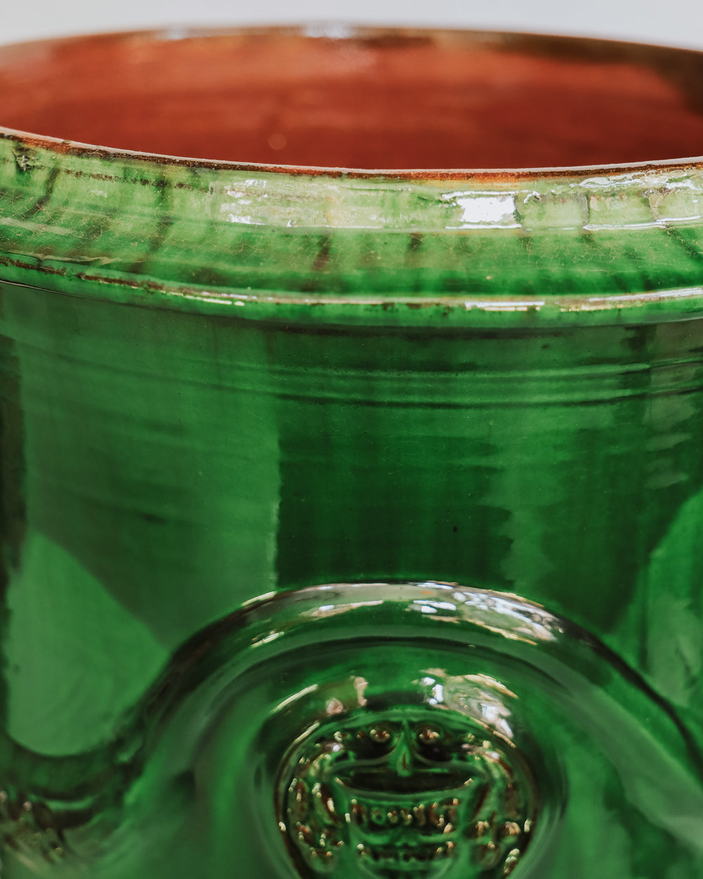 Close-up of a ceramic Anduze jar or pot in emerald green