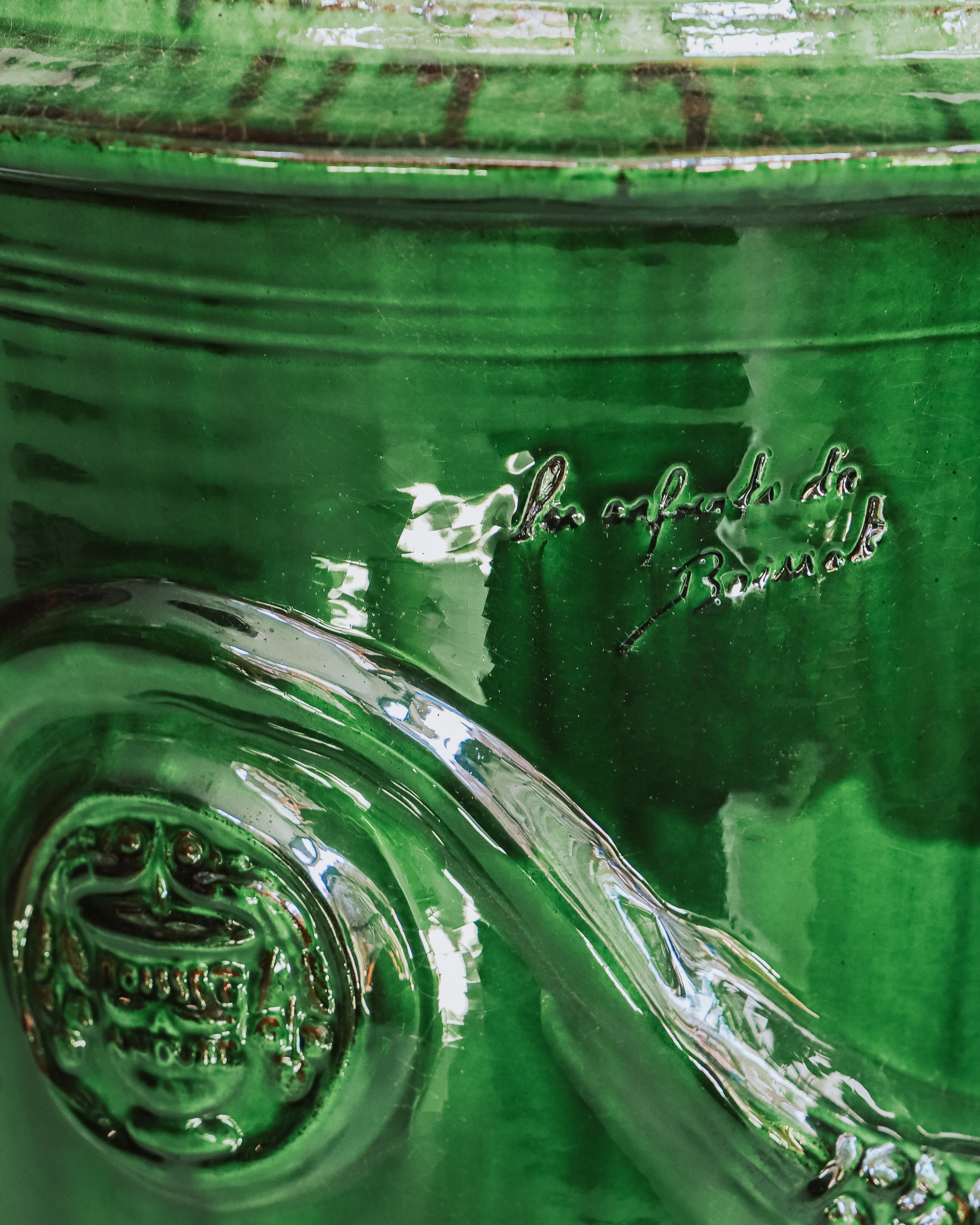 Close-up of a ceramic Anduze jar or pot in emerald green
