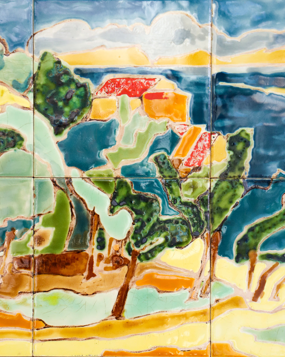 Close-up of a colorful mid-century French ceramic glazed tile panel depicting the scenic village of Anduze, famed for its pottery factories.