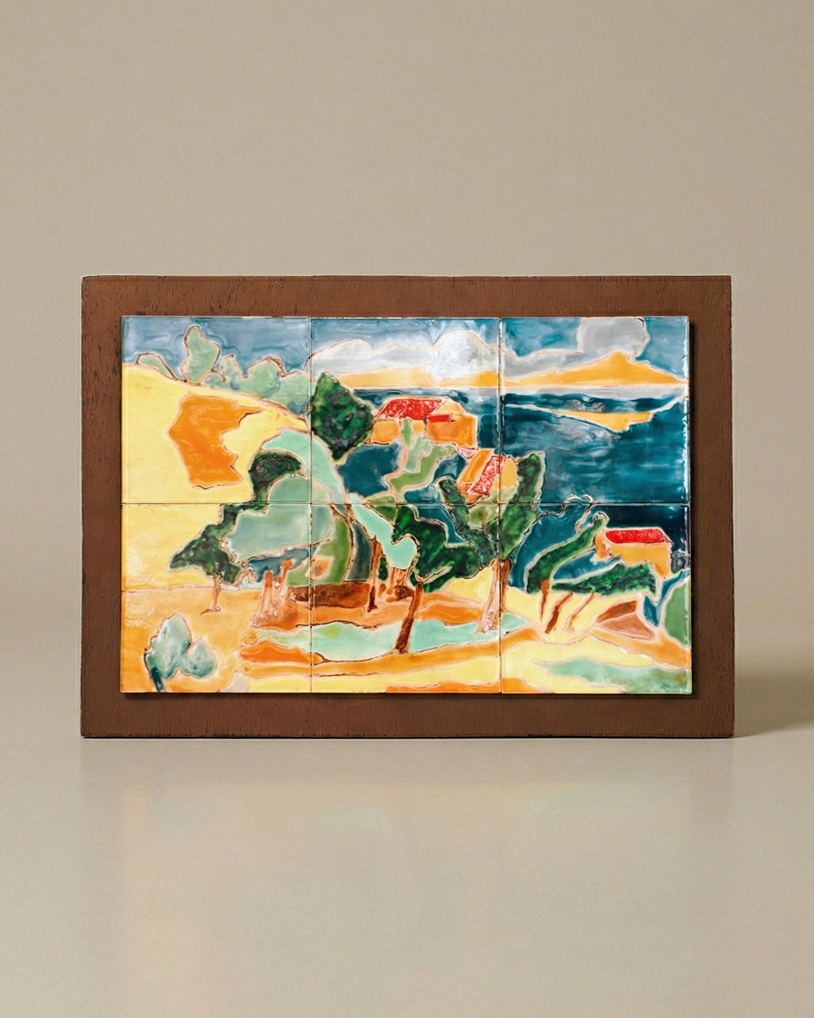 Framed ceramic tile mosaic of a landscape in France close to Anduze, with buildings and trees on a beige background. Vintage artwork, available via Wildschut Antiques.