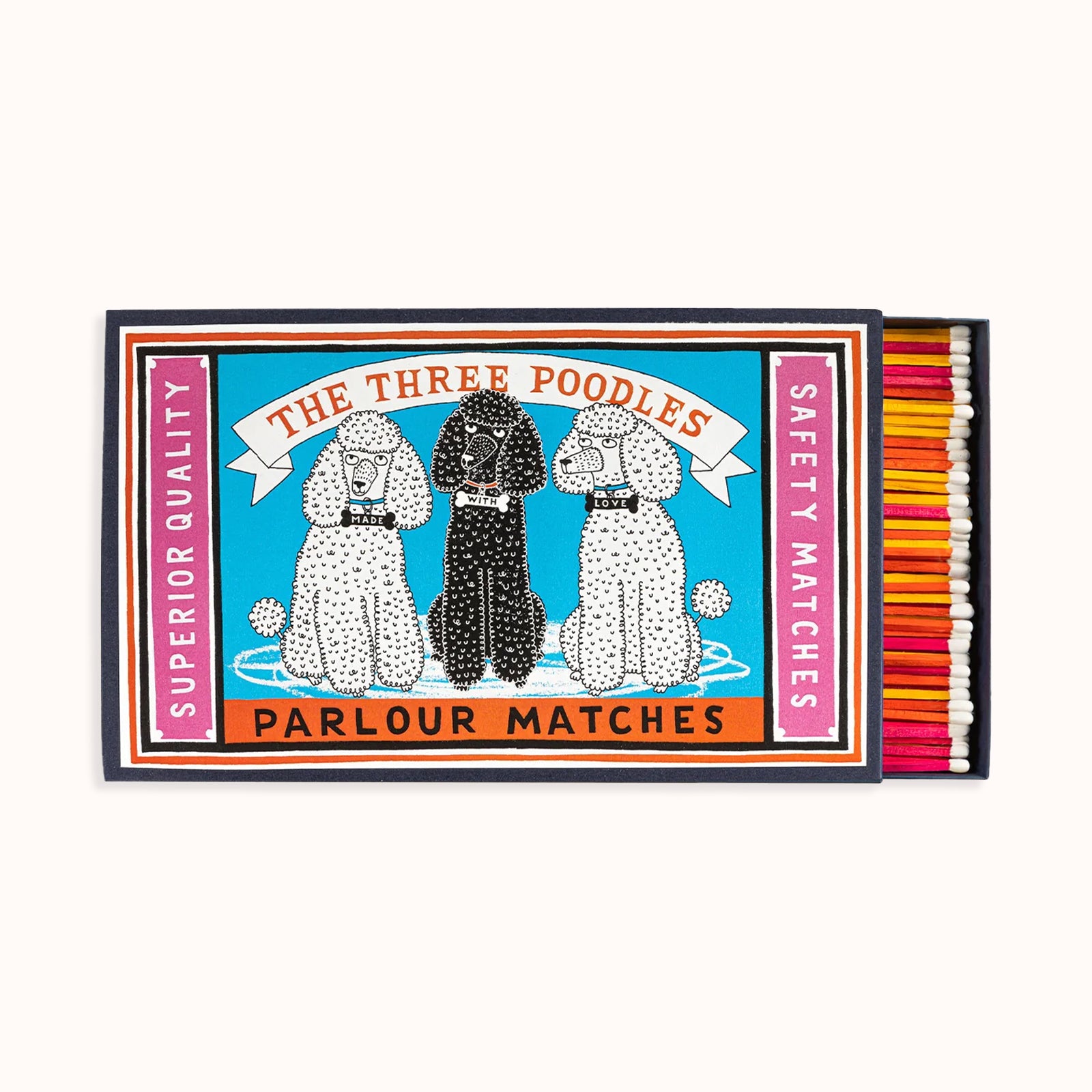 A large matchbox featuring an illustration of three poodles with a colorful background, labeled 'The Three Poodles' and 'Parlour Matches'. The box is filled with matches that are visible at the bottom. Part of the Archivist Gallery Collection, available at Wildschut Antiques.