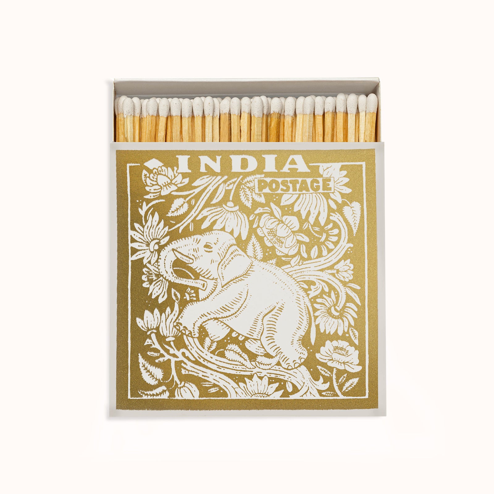 A gold matchbox with a vintage stamp design featuring an elephant, part of the Archivist Gallery collection, available at Wildschut Antiques