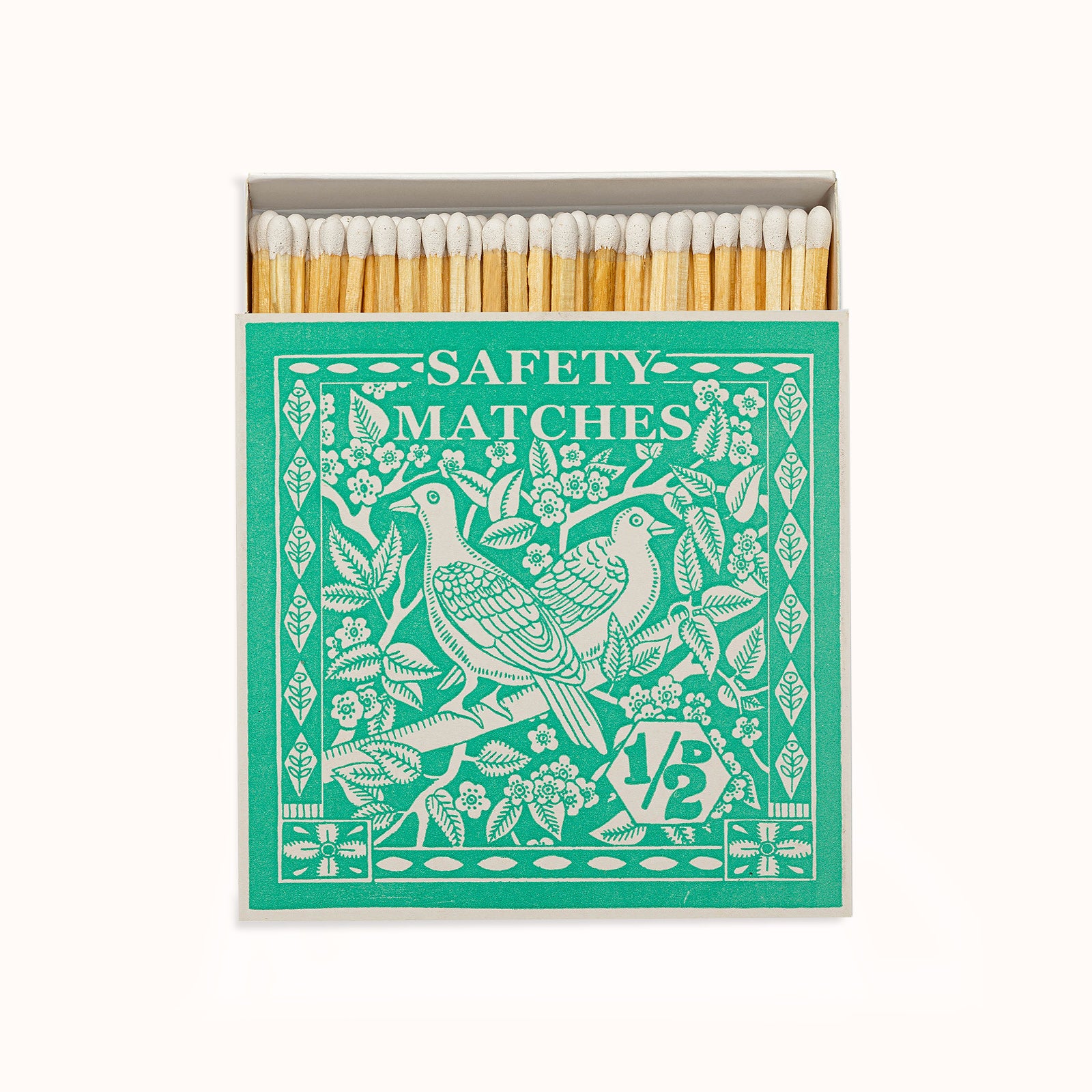 A green matchbox featuring an artistically designed bird and floral pattern, labeled 'Safety Matches'. The matches are visible inside the open box. Part of the Archivist Gallery collection, available at Wildschut Antiques.