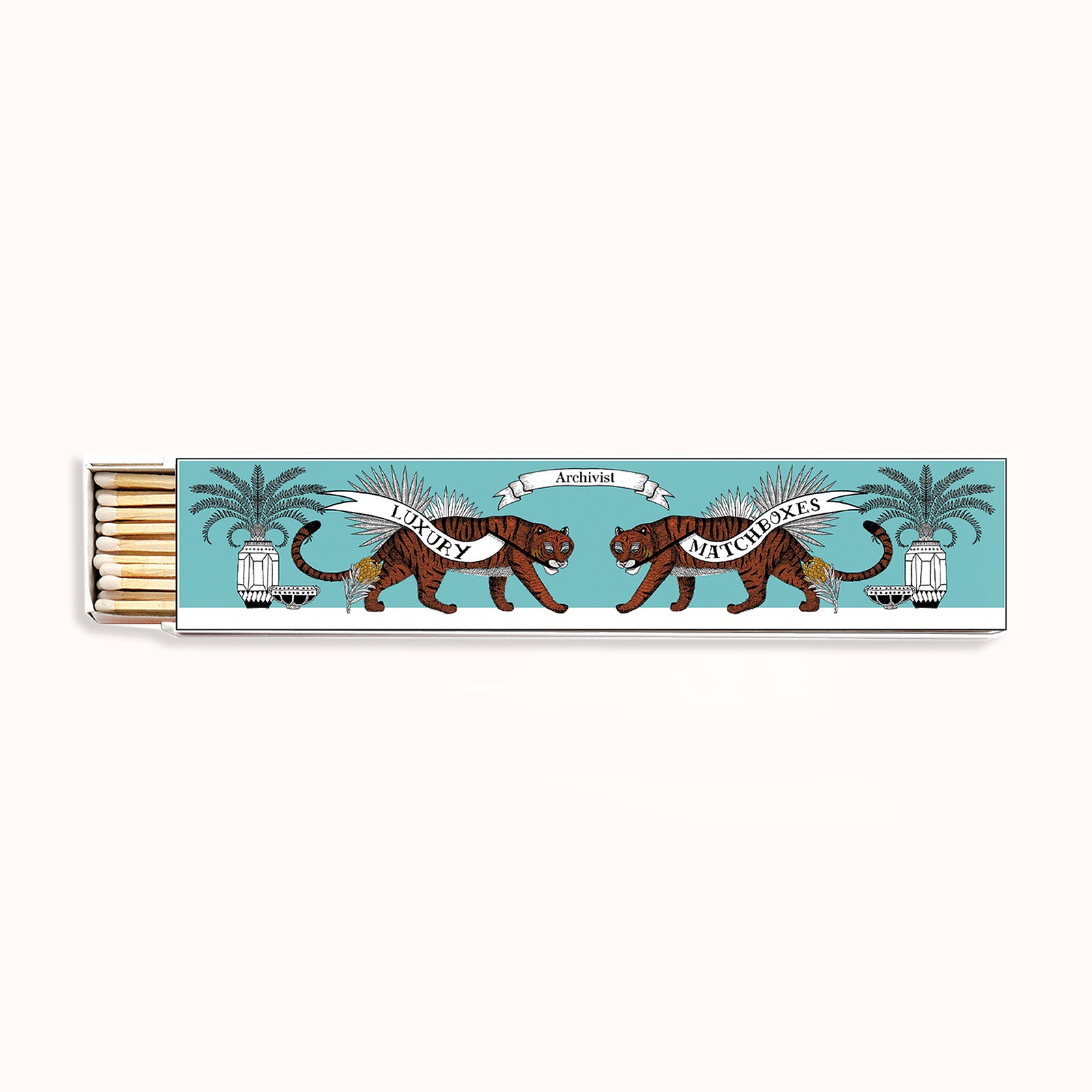 A long matchbox with a blue background featuring an illustration of two tigers, palm trees. Part of the Archivist Gallery Collection, available at Wildschut Antiques.