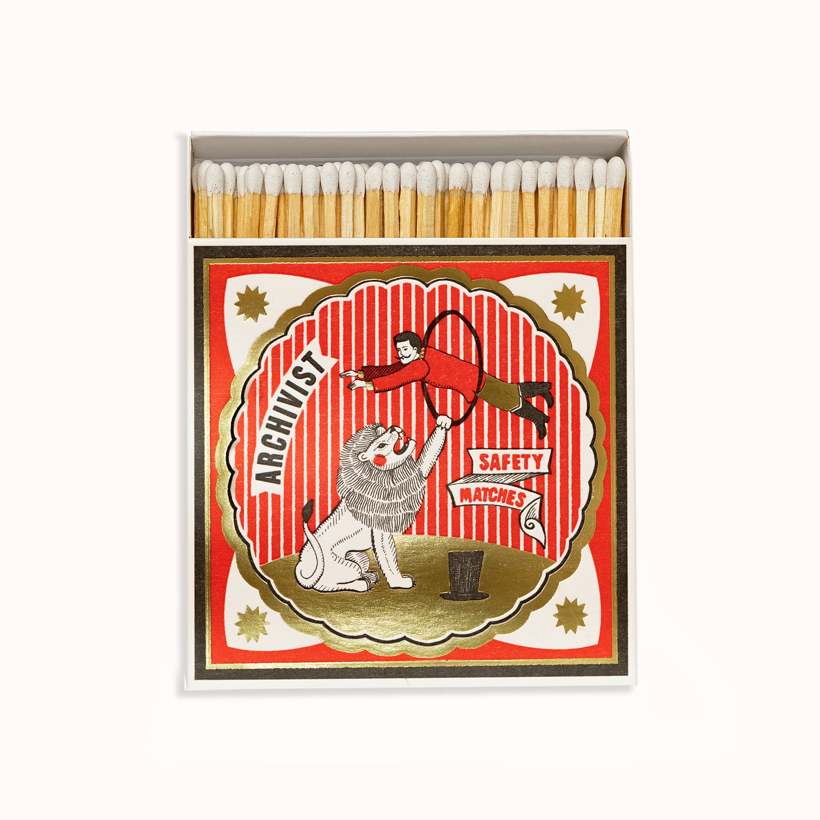 A matchbox from Archivist Gallery featuring an illustration of a white lion and a circus tent in the background, available at Wildschut Antiques.