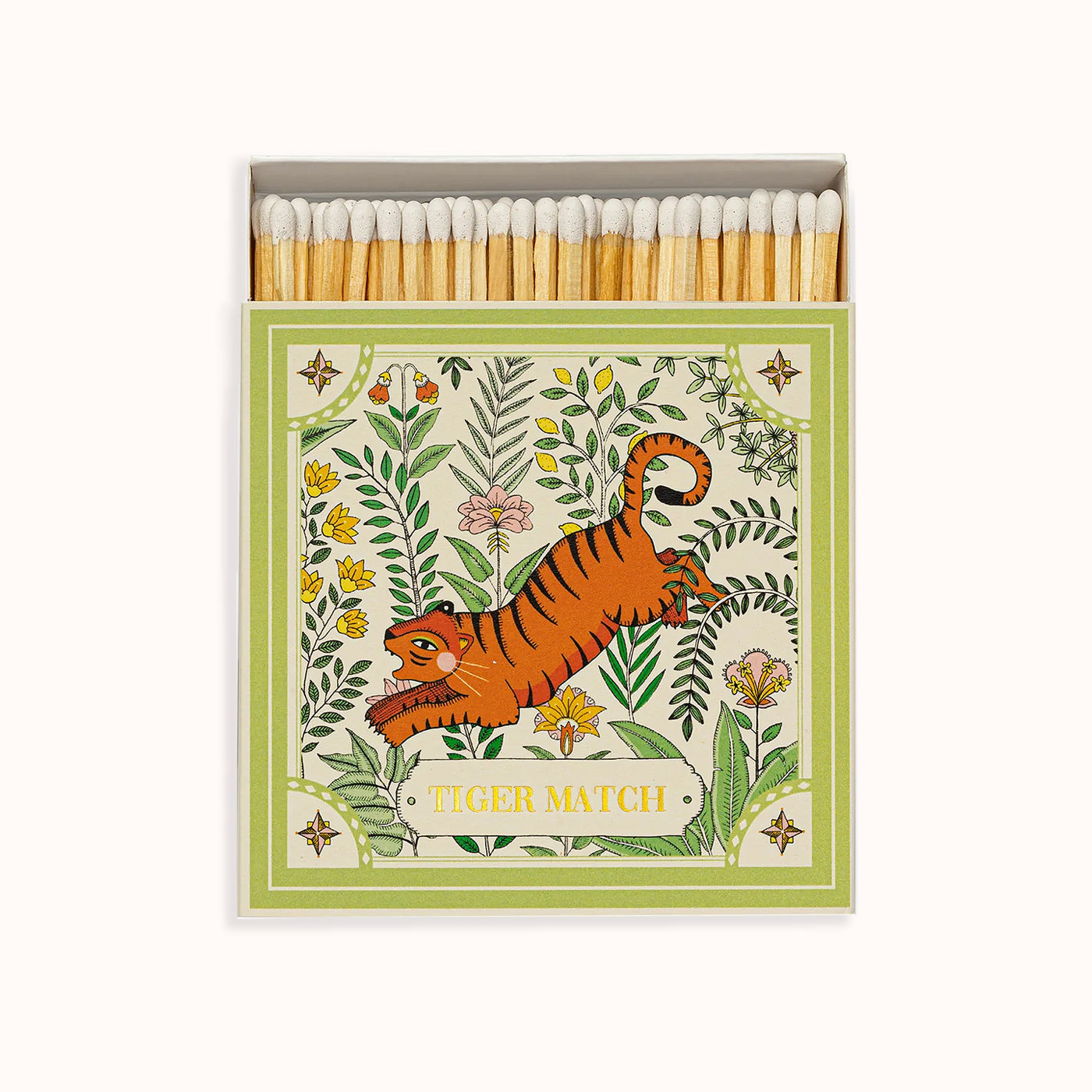 A matchbox with a green and orange tiger illustration surrounded by a botanical design. Part of the Archivist Gallery Collection, available at Wildschut Antiques.