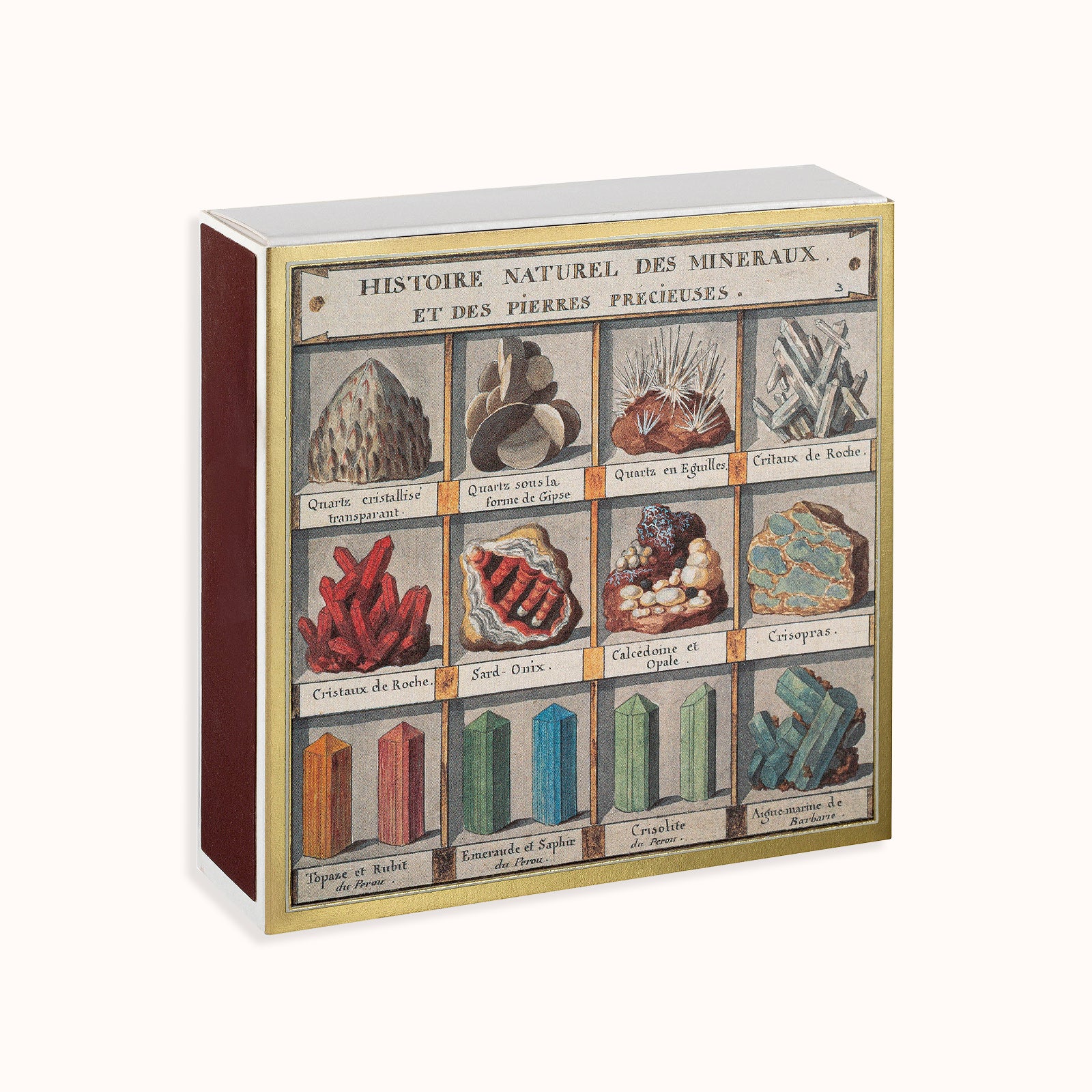 A matchbox with a display of various mineral specimens and their names in both English and French, indicating a collaboration with the Natural History Museum. Part of the Archivist Gallery Collection, available at Wildschut Antiques.