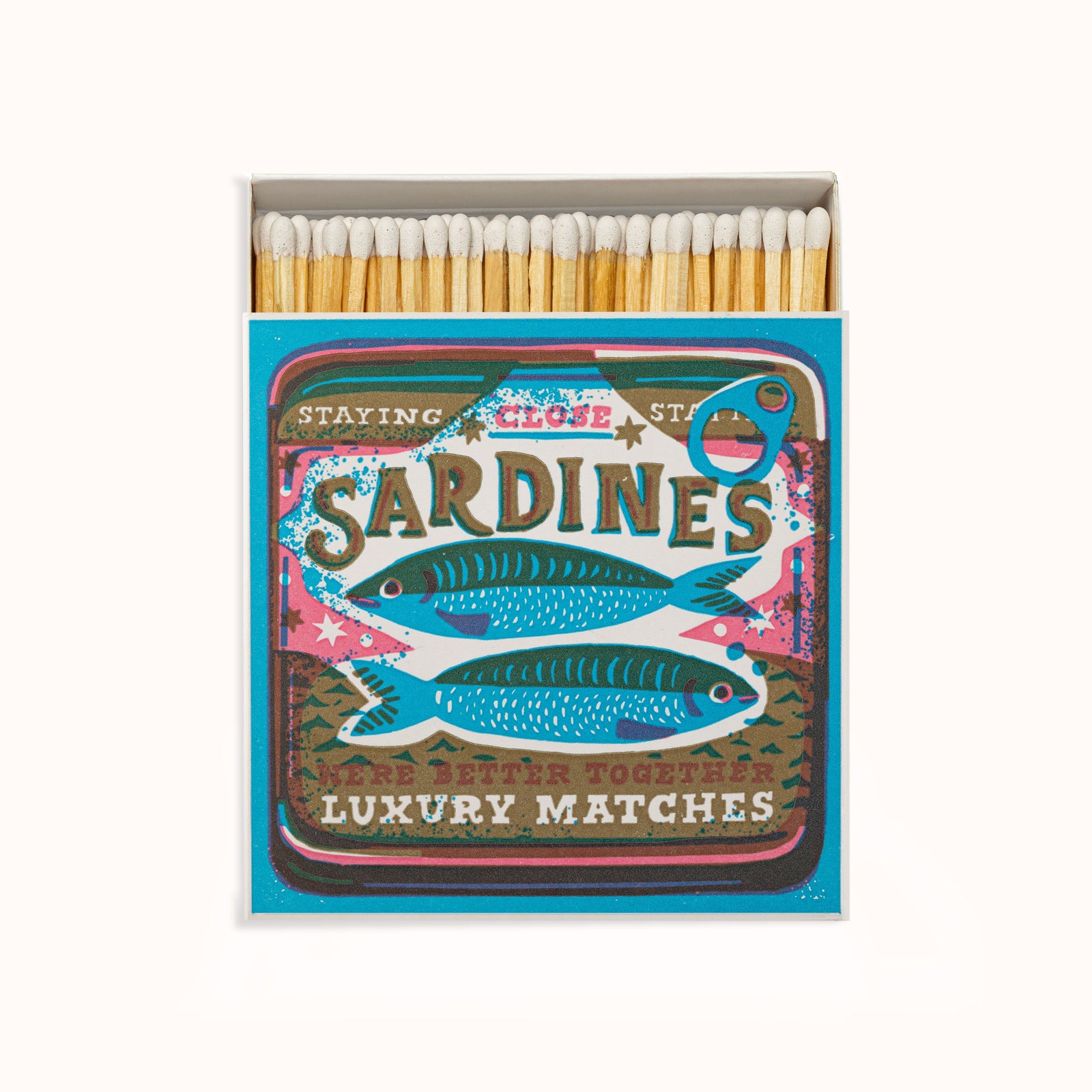 A box of Archivist Gallery luxury matches with a colorful sardine design. The matches are displayed in a clear case with a blue border, and the artwork includes vibrant fish illustrations, available at Wildschut Antiques