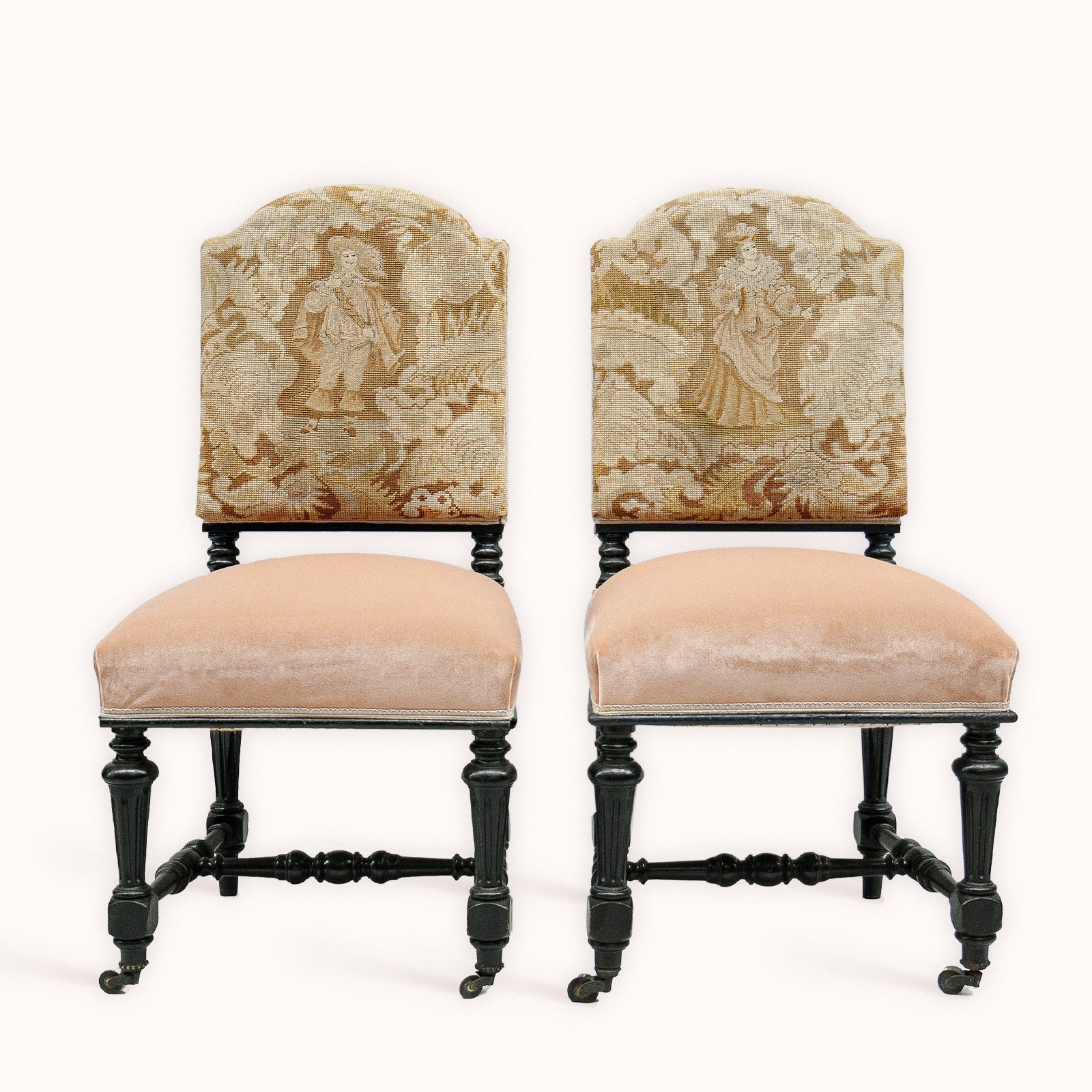 Pair of antique chairs with black carved wooden frames, pink velvet seats, and 17th-century style Aubusson tapestry backs featuring a man and woman in period costume, available at Wildschut Antiques