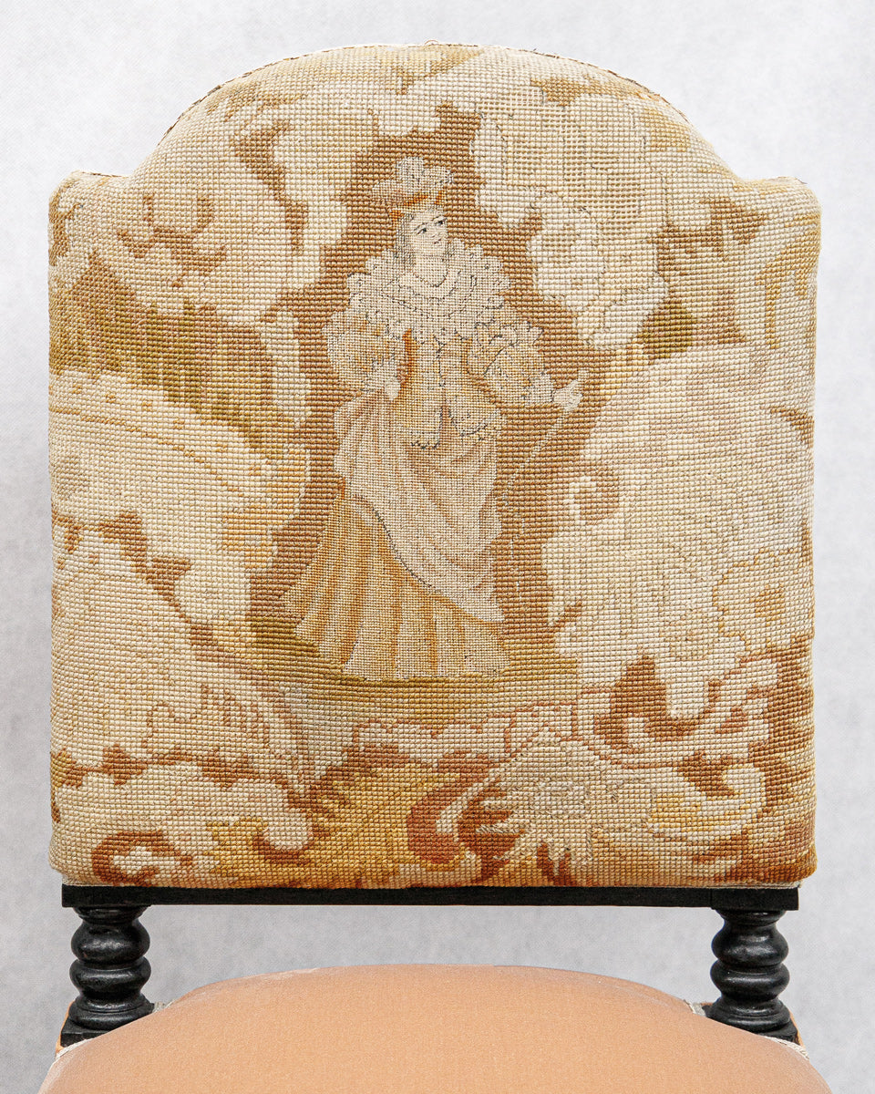 Chair with decorative Aubusson tapestry fabric featuring a woman in a gown on a floral background