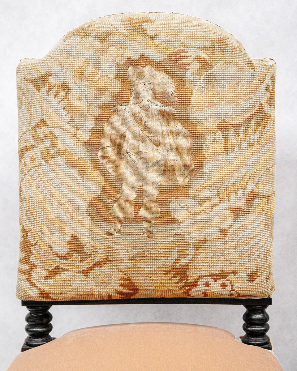 Chair with decorative Aubusson tapestry fabric featuring a person in historical attire on a floral background