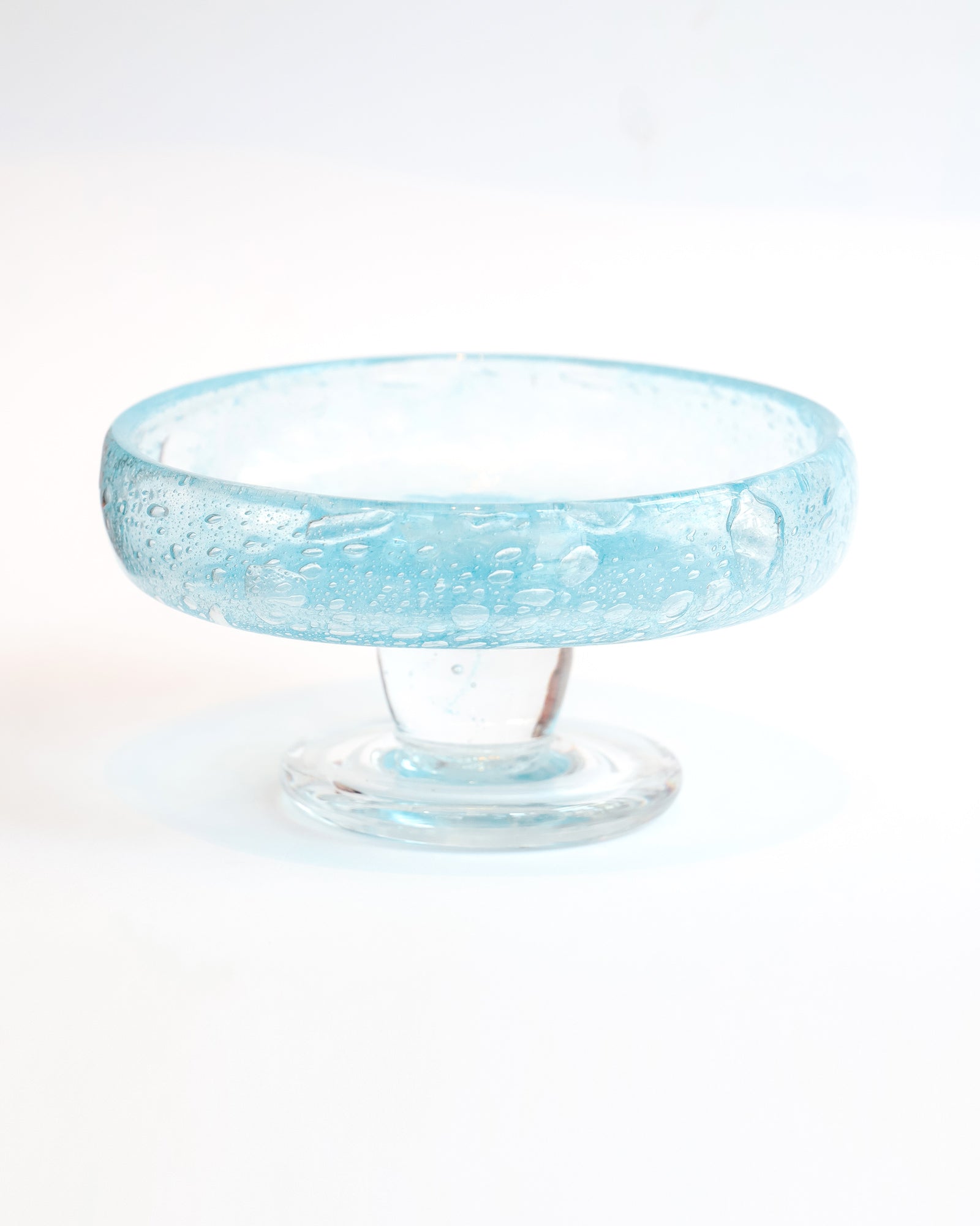 Vintage round blue glass fruit bowl resembling a heavy glass droplet, likely by Biot, France.