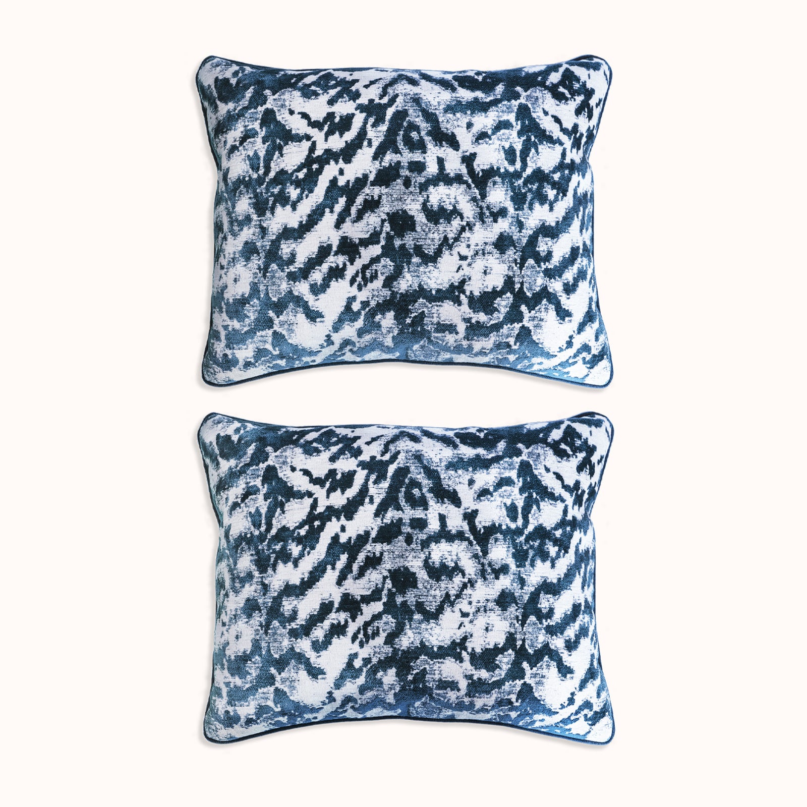 A set of two square-shaped throw pillows with a velvet blue tiger pattern, available at Wildschut Antiques
