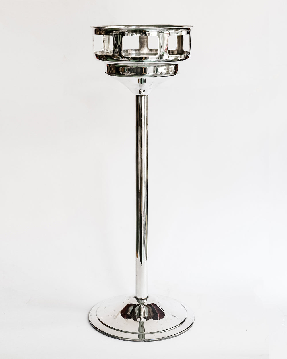Vintage silver plated champagne bucket stand, with a sleek, cylindrical shape and a reflective surface, crafted by Christofle, available at Wildschut Antiques