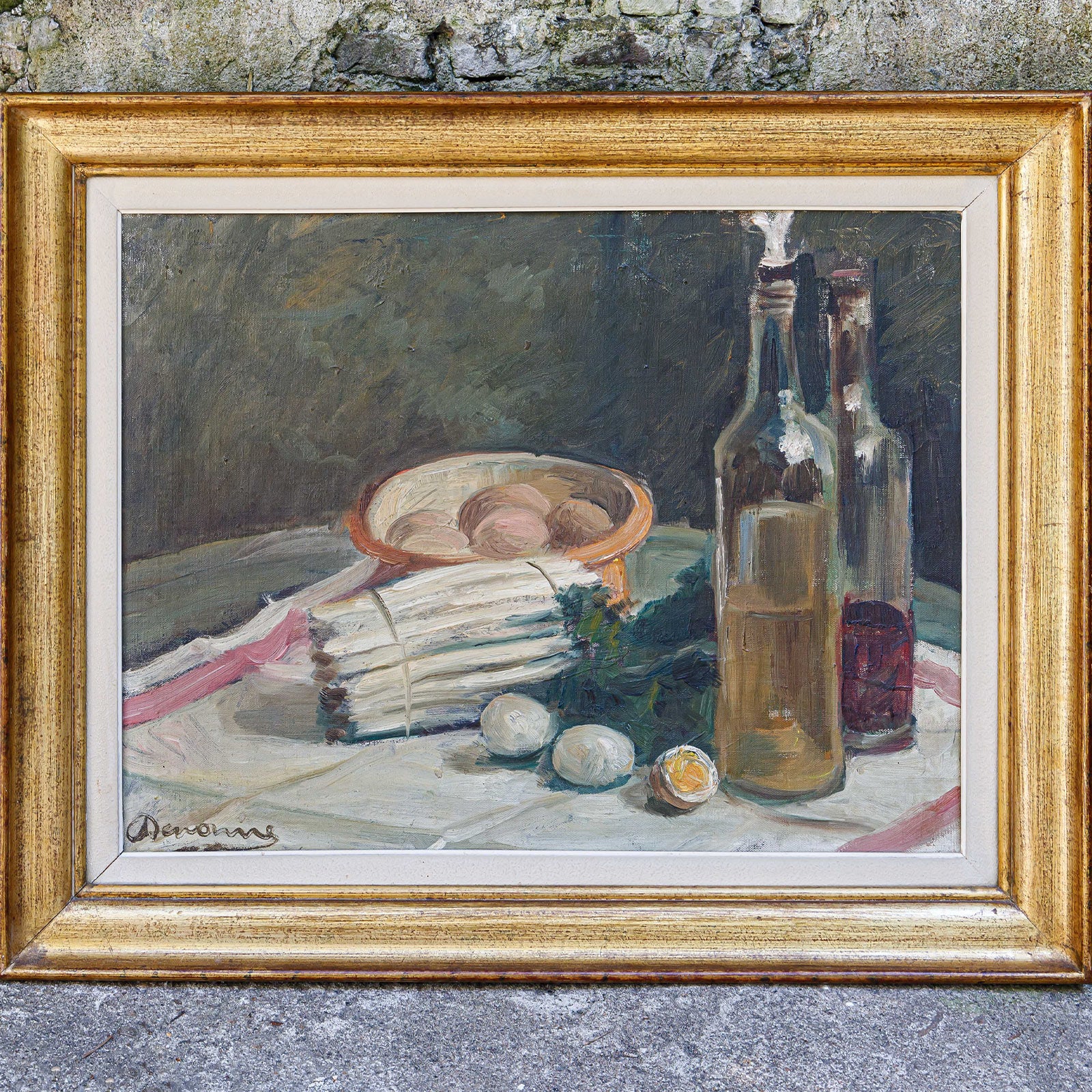 Lovely early 20th-century still life painting by Alexandre 'Alex' Denonne (Belgium, 1879–1953), featuring asparagus and eggs with two bottles.