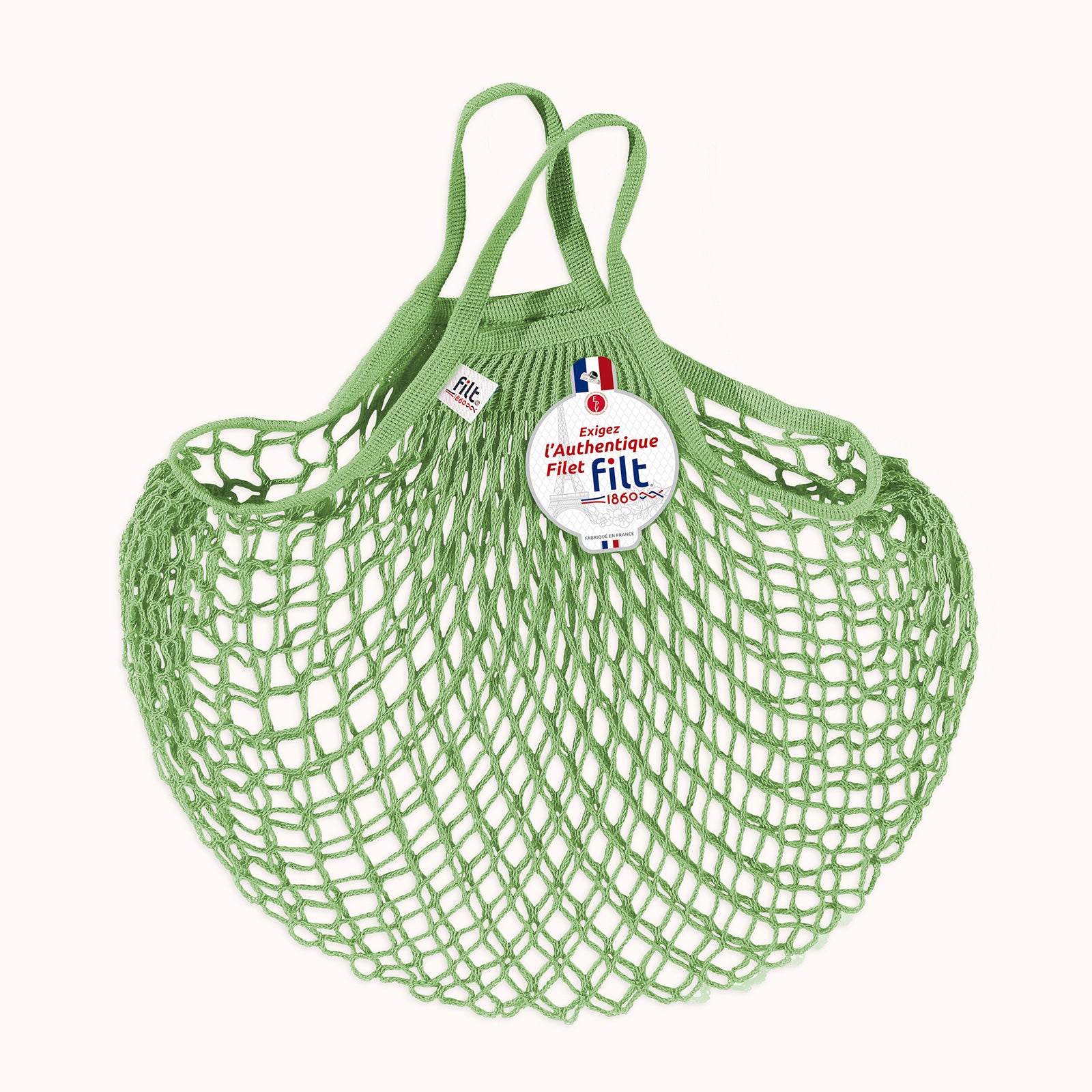 Green mesh shopping bag with Filt 1860 label on a white background