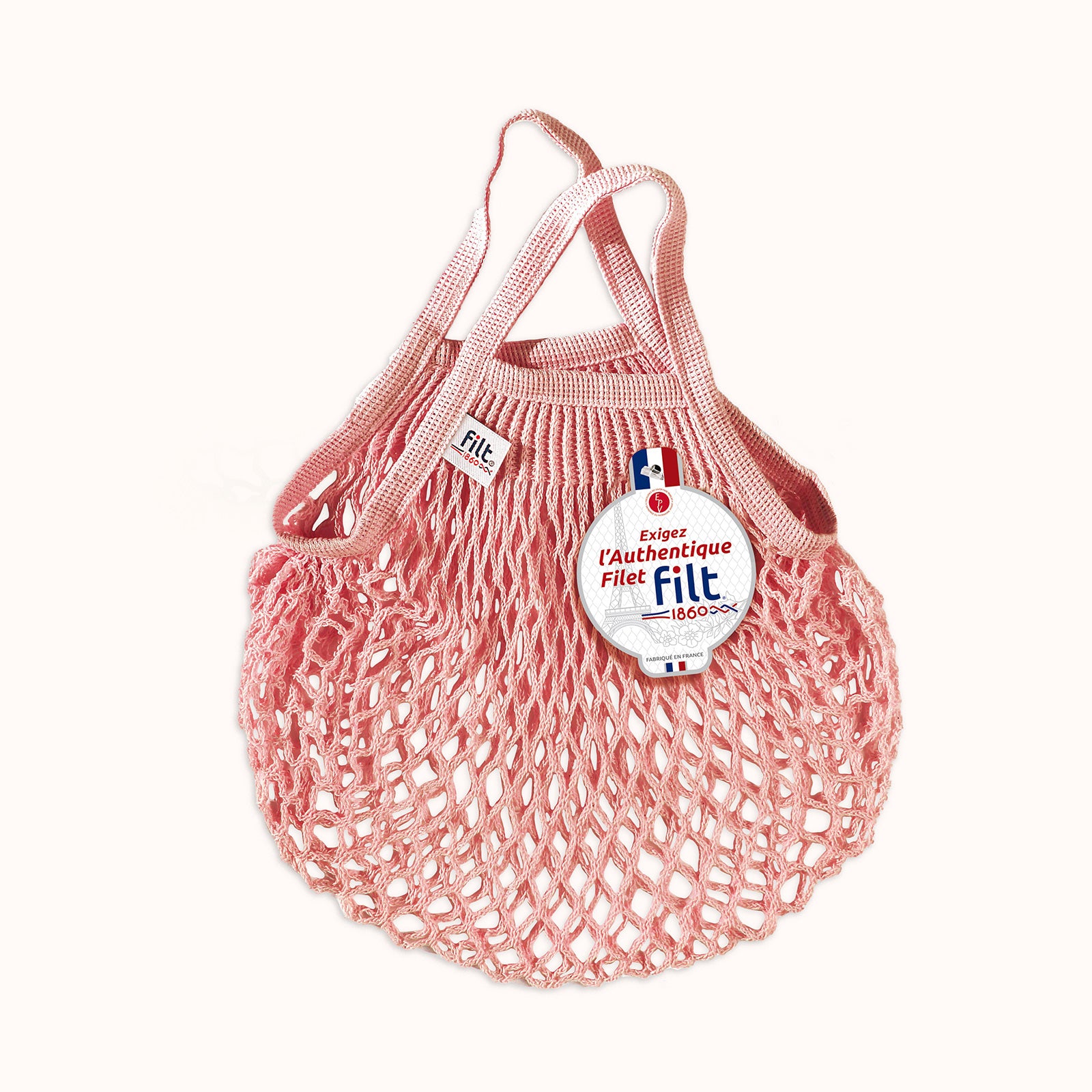 Pink mesh shopping bag with 'filt 1860' branding on a white background, available at Wildschut Antiques