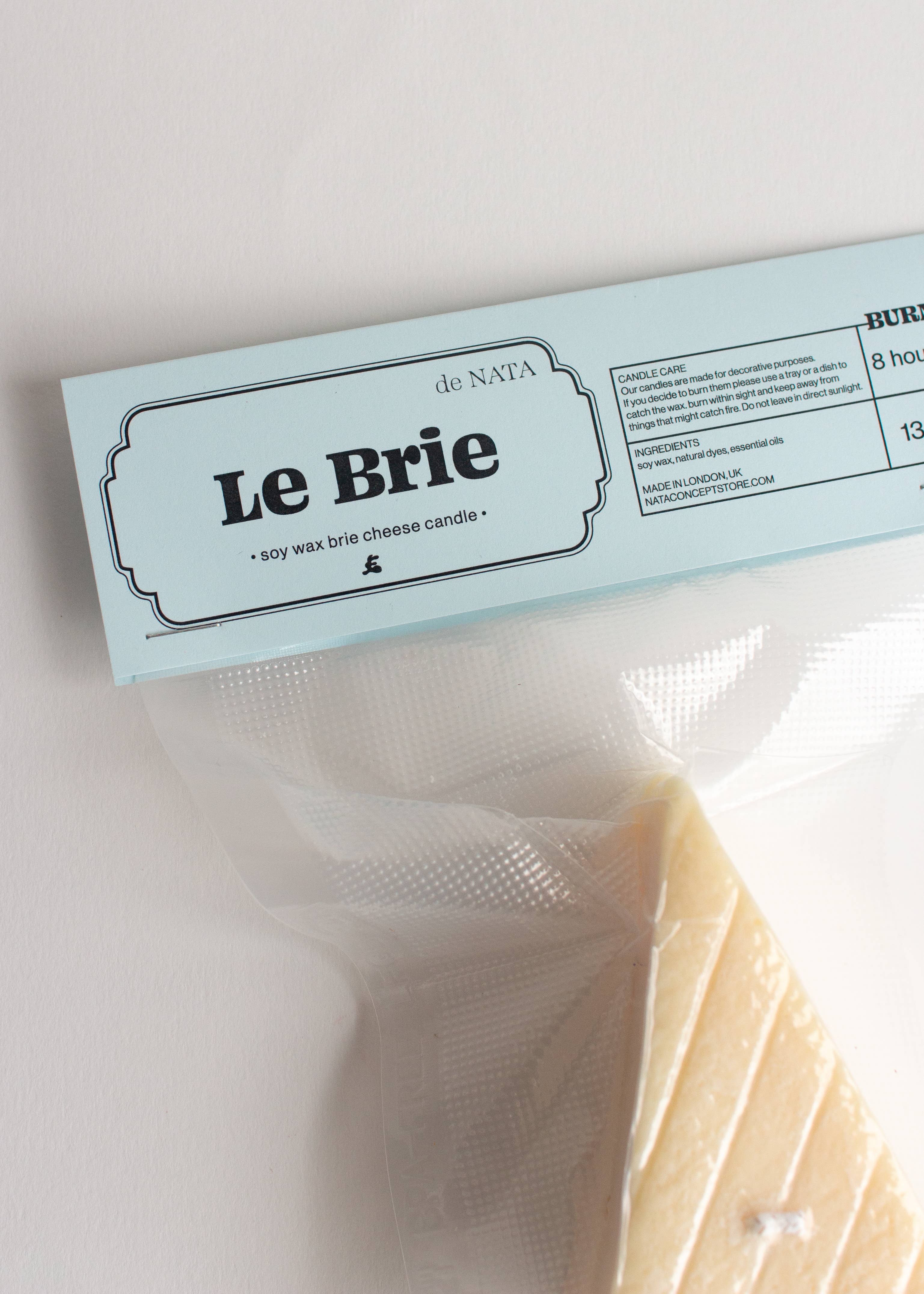 Le Brie candle packaging with a white background, Part of the Playful Food Candle Collection available via Wildschut Antiques Concept Store