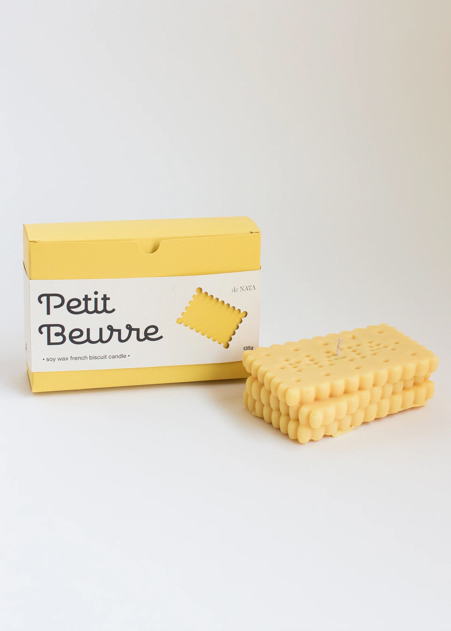Rectangular biscuit-candle with 'Petit Beurre' packaging on a white background. Part of the Playful Food Candle Collection available via Wildschut Antiques Concept Store.