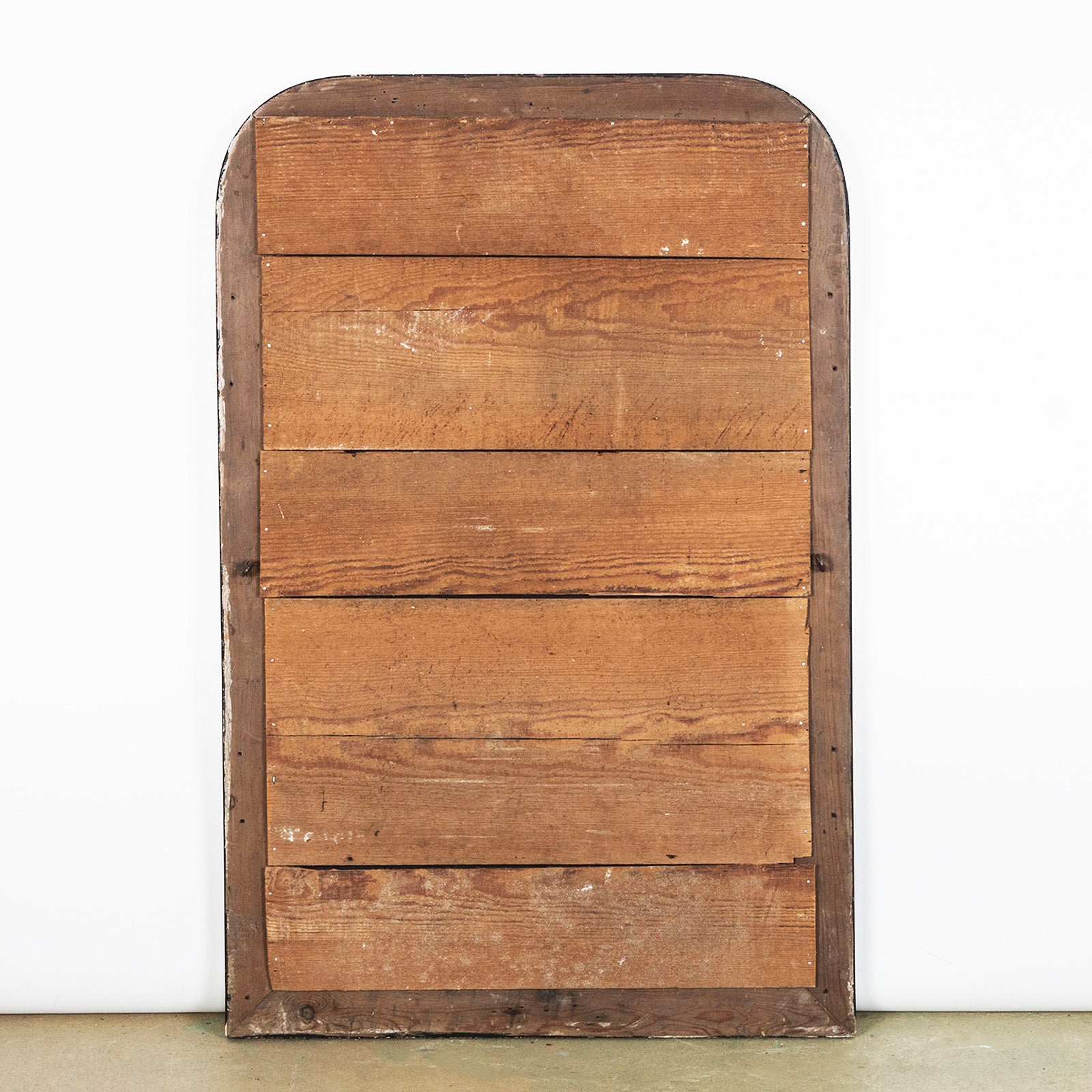 Wooden back cladding of an antique black and gold frame mirror