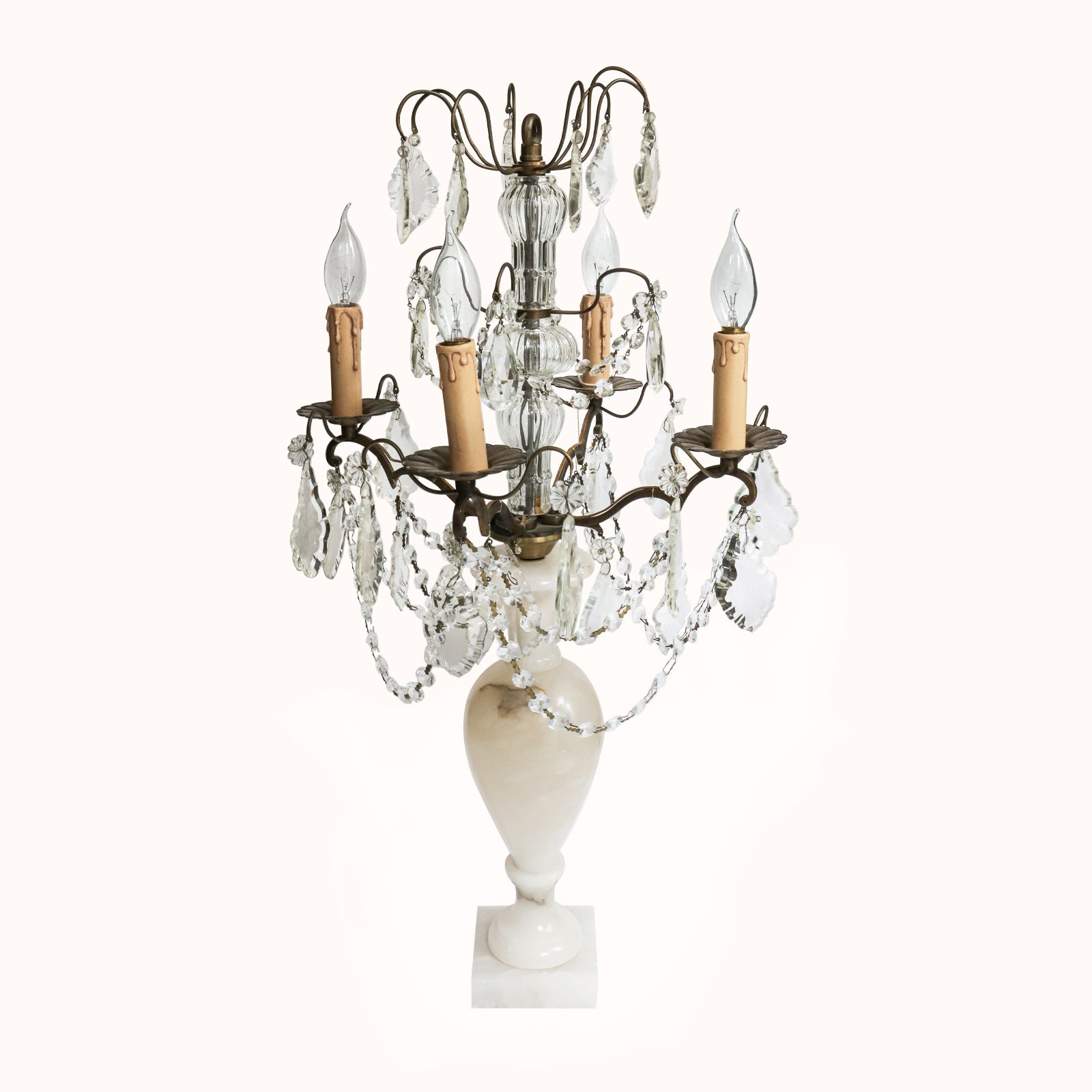 A 19th C French crystal chandelier-style table lamp with a white base, featuring a central candle holder and decorative crystal elements, available at Wildschut Antiques