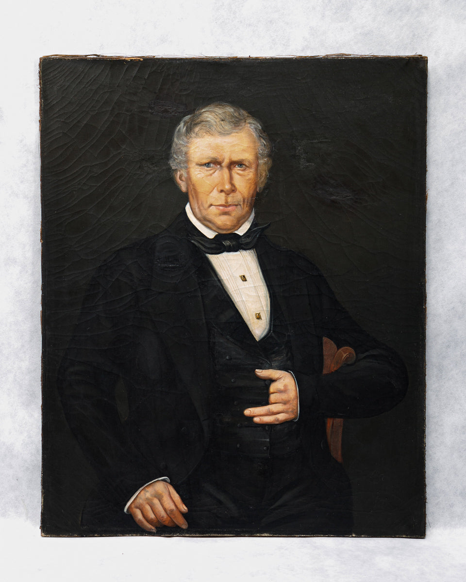 Antique 19th-century oil portrait of a man in formal attire set against a dark background