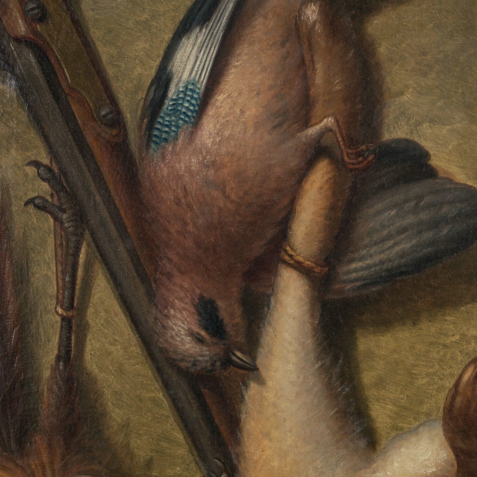 Close-up of an antique French oil painting showing a hunting still life with a rabbit and birds, featuring rich, textured brushwork.