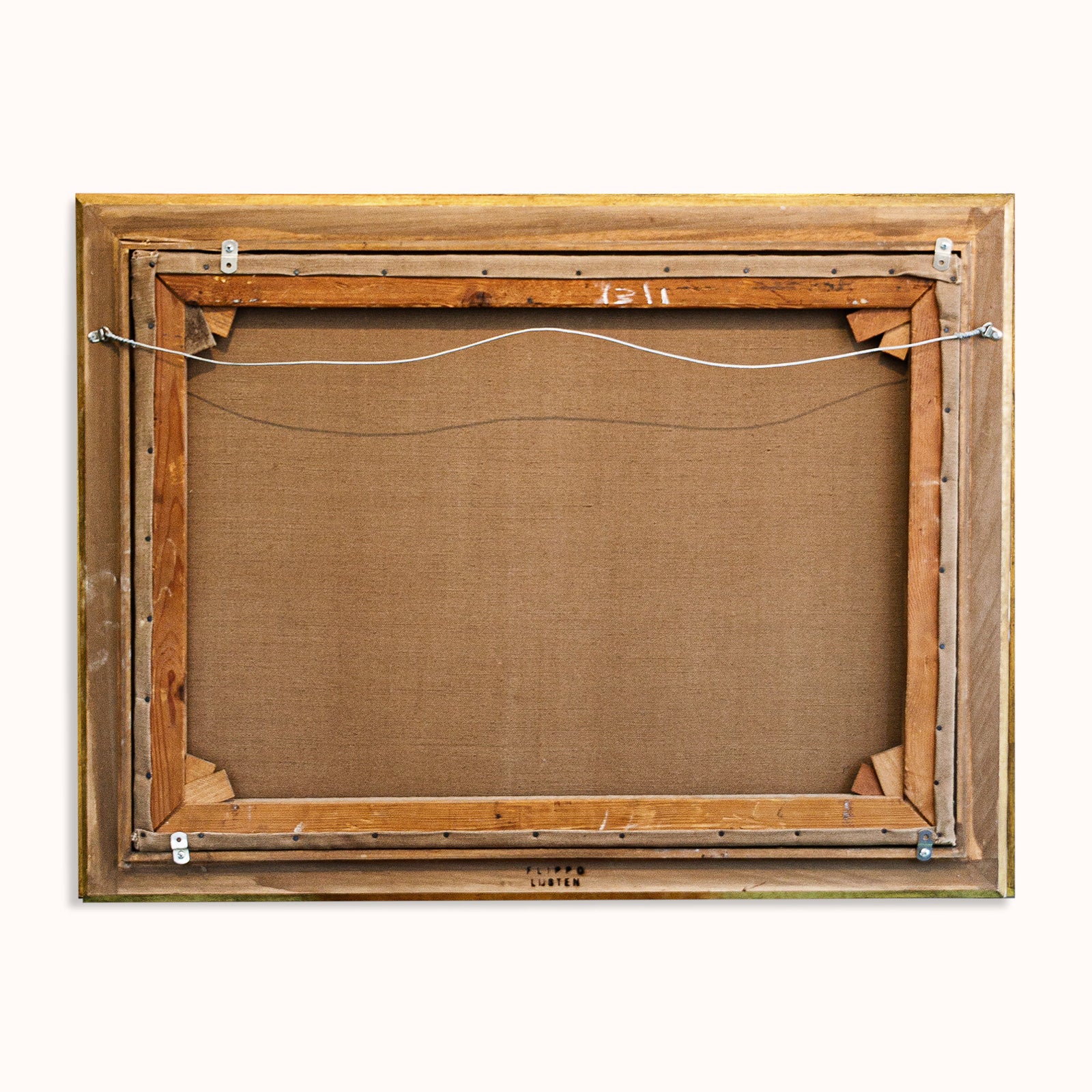 Back of a wooden painting frame with visible hardware on a white background