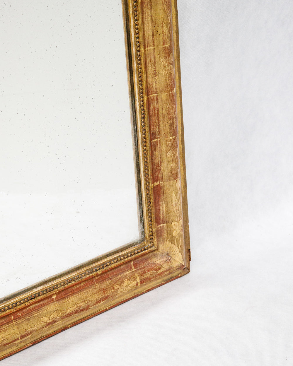 Close-up of the frame of a large antique French Louis Philippe mirror
