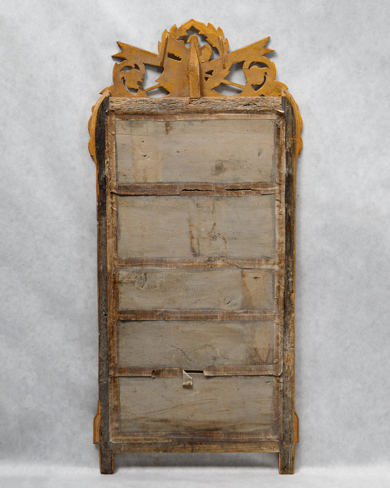 Wooden back cladding of an antique French mirror with a crest