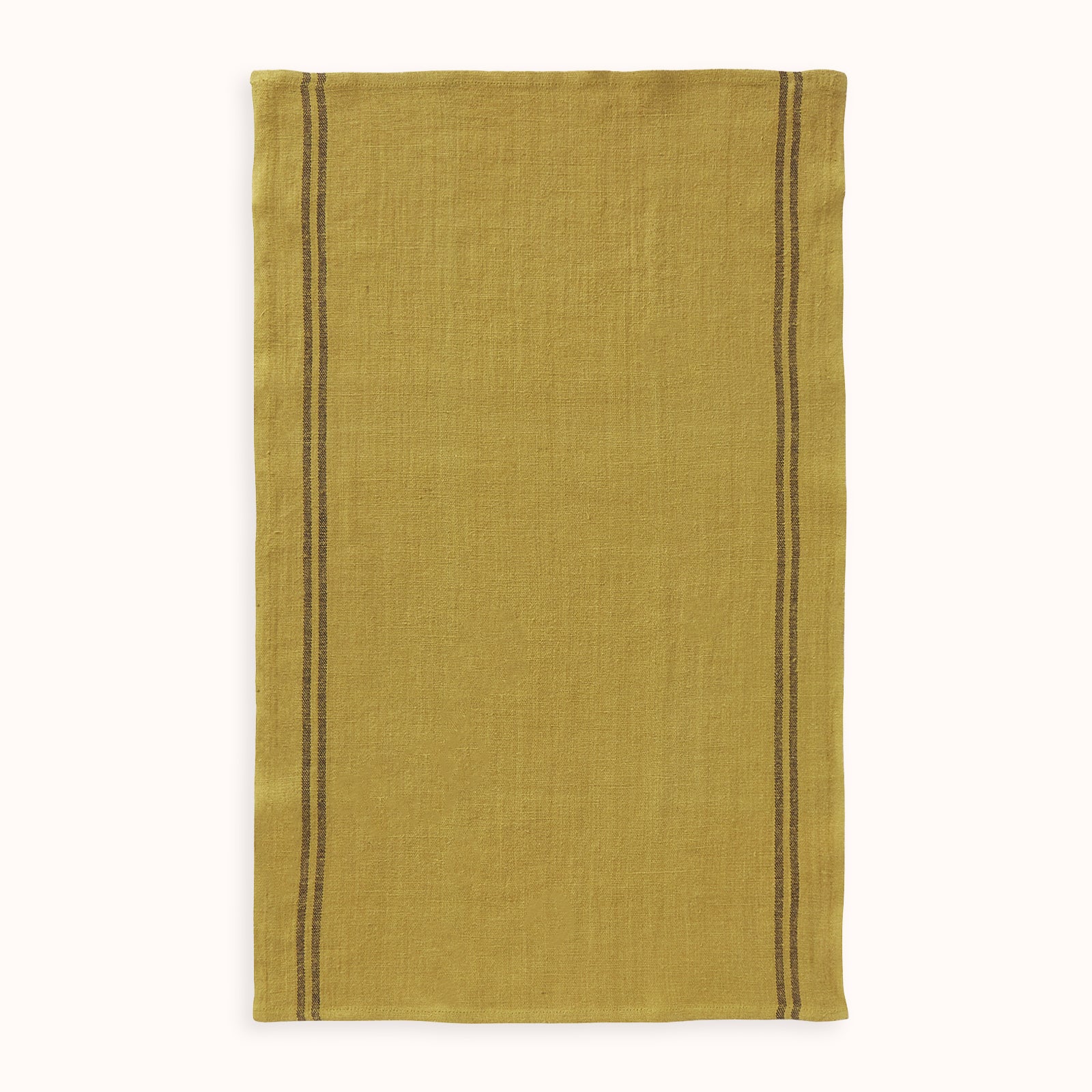 A yellow ochre linen dish towel with dark stripes on the edges by Charvet Editions available by Wildschut Antiques.