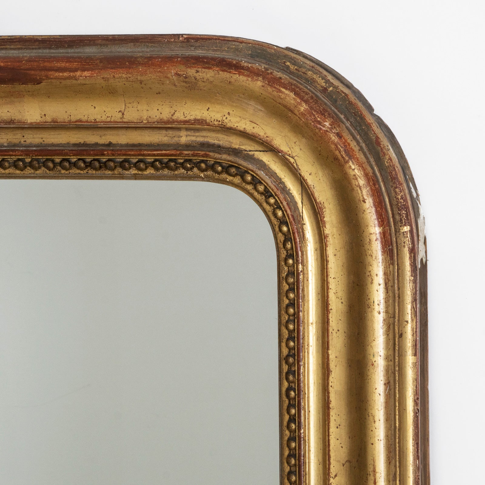 Detailed right upper corner of a French antique Louis Philippe style mirror