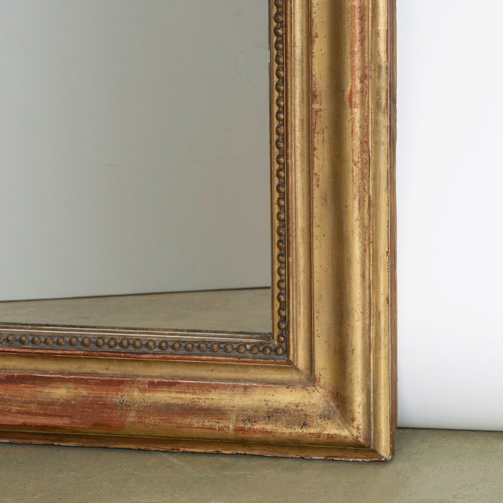 Detailed right bottom corner of a French antique Louis Philippe mirror