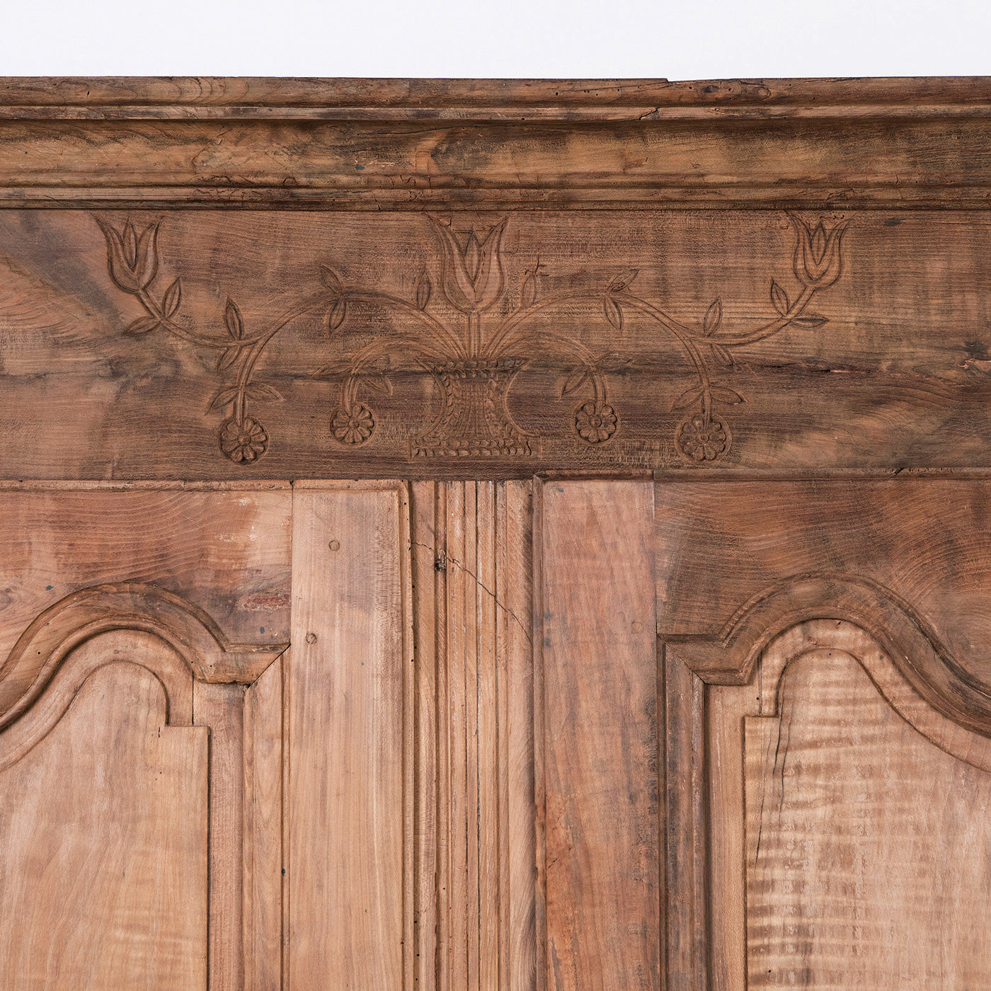 Close-up of a 19th C Antique French Louis XV style armoire with double doors and rustic wooden texture, available at Wildschut Antiques
