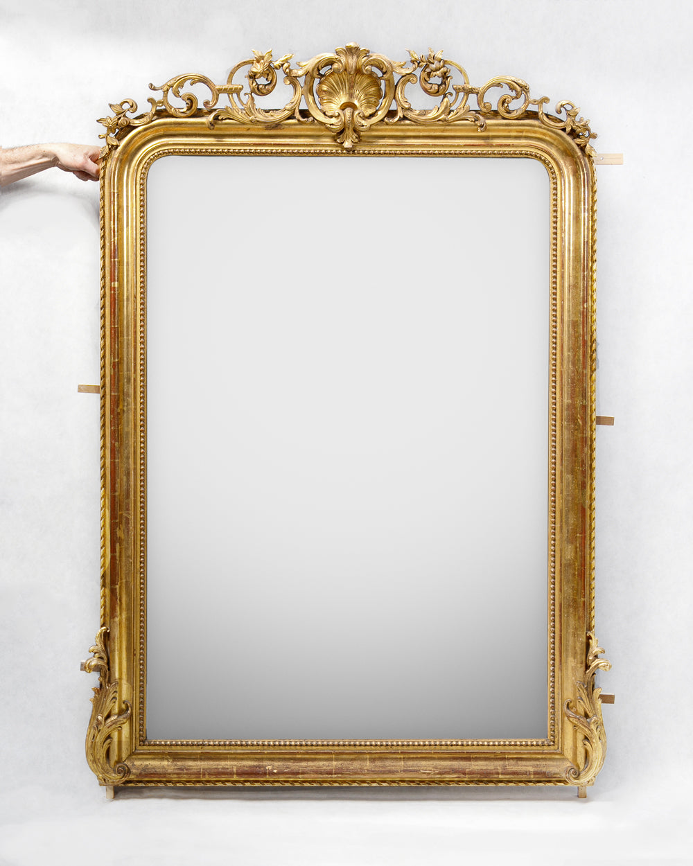 Antique French 19th Century Louis Philippe style gold gilt mirror with shell crest, leaf and flower ornaments, and pearl beading, available at Wildschut Antiques