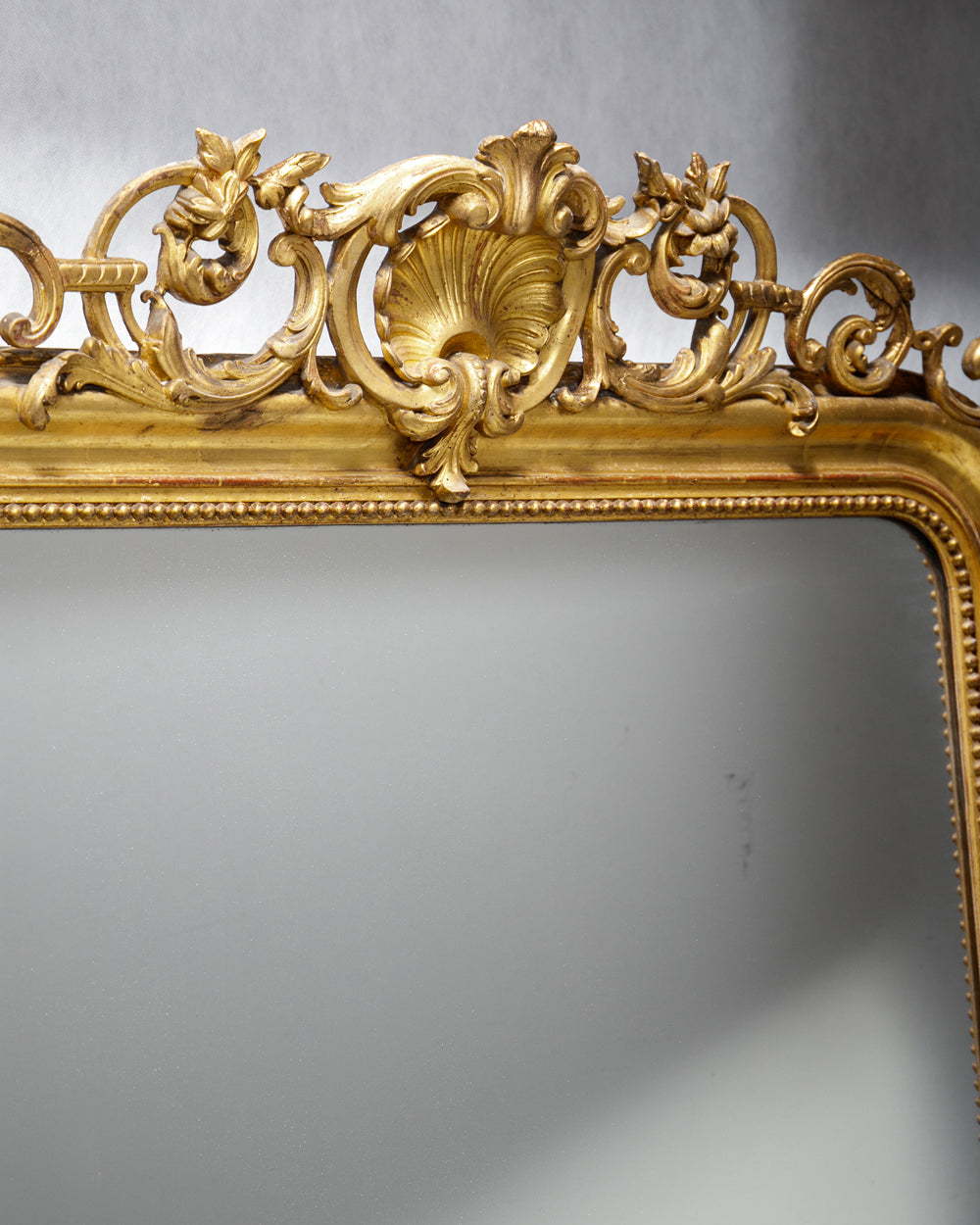 Decorative shell shaped crest belonging to an antique French 19th Century Louis Philippe style gold gilt mirror