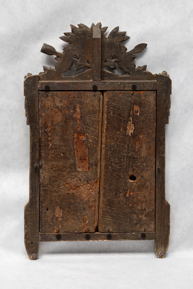 Wooden backside of an antique French Louis XVI period giltwood trumeau mirror with a finely carved crest