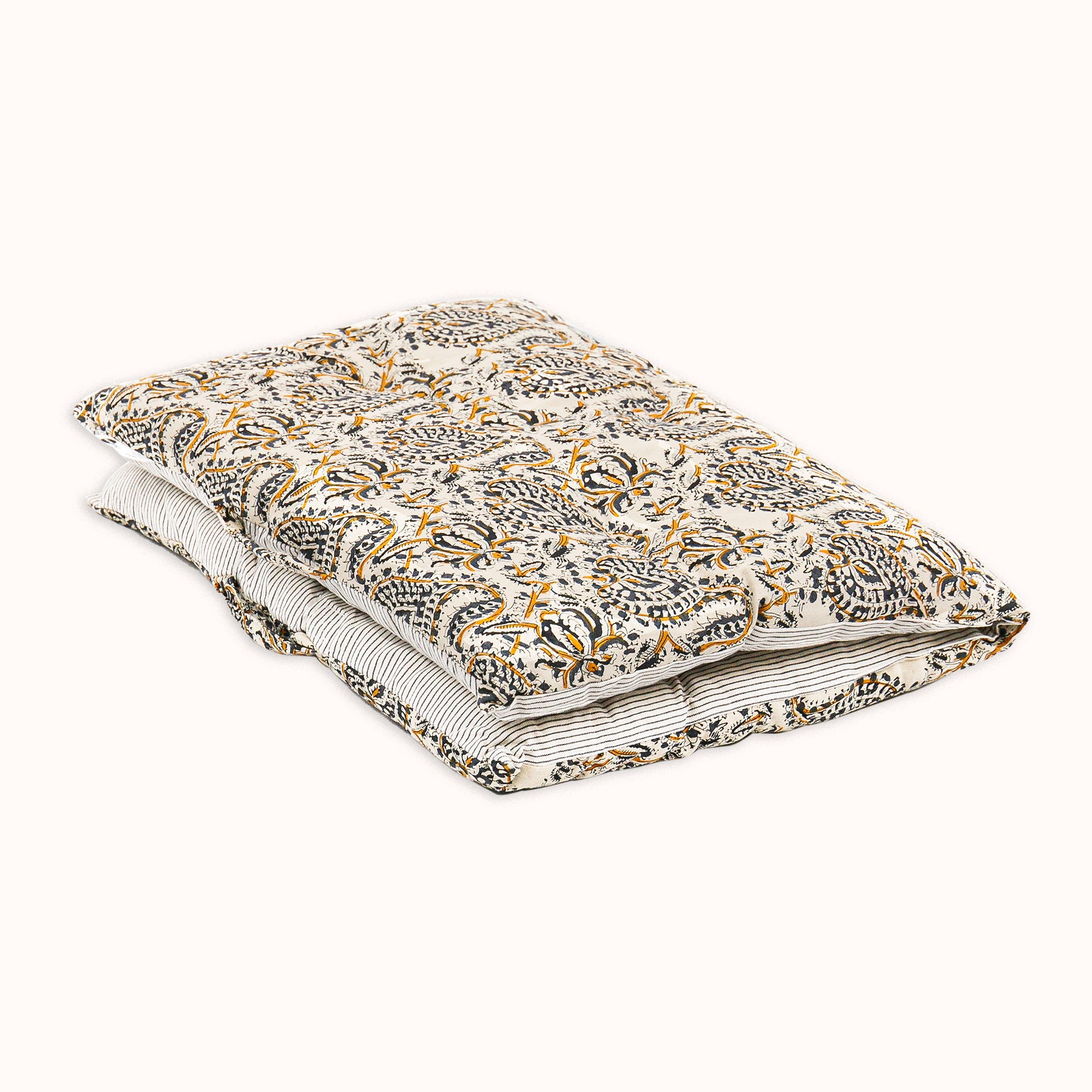 Folded mattress pillow with floral paisley pattern on a white background available at Wildschut Antiques