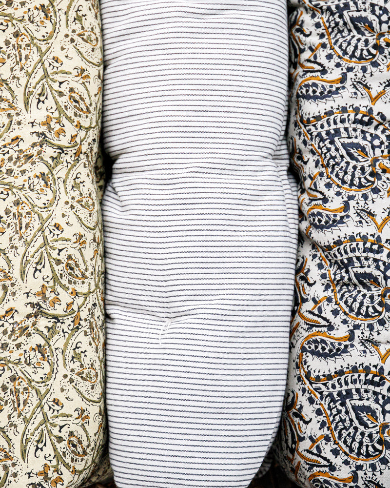 Three fabric swatches with different patterns arranged side by side.