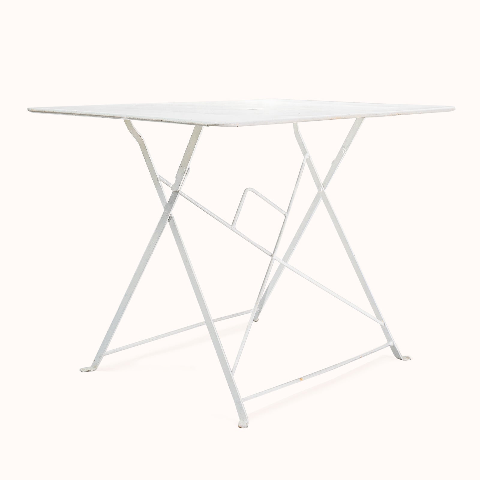 Vintage French white rectangular metal folding garden table with collapsible frame, from Wildschut Antiques, on a plain background