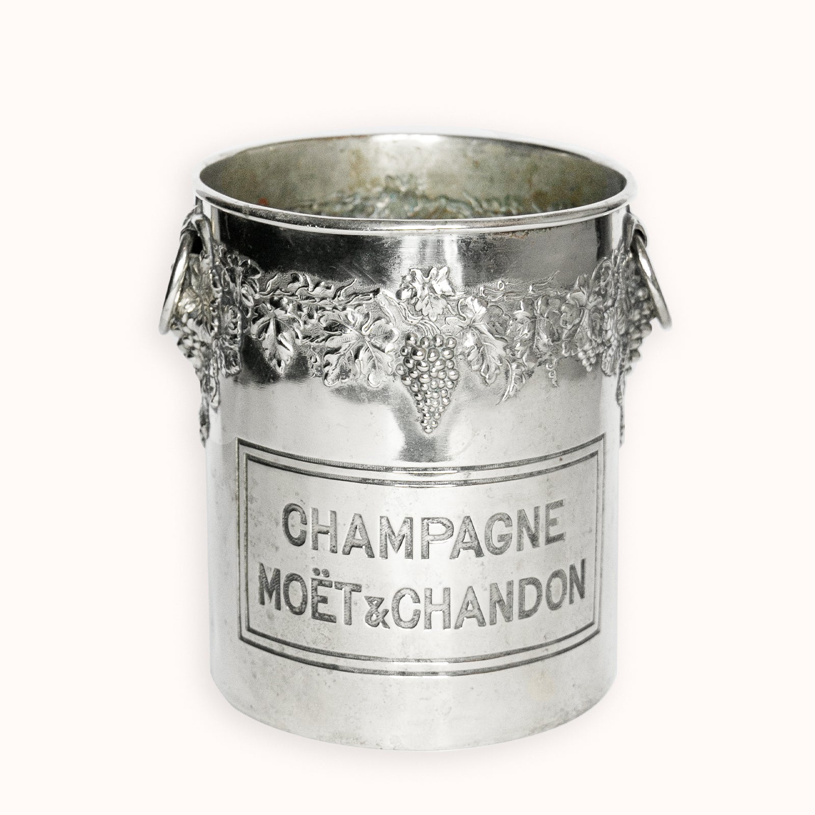 Vintage silver champagne bucket with Moét é Chandon branding on a white background, available via Wildschut Antiques