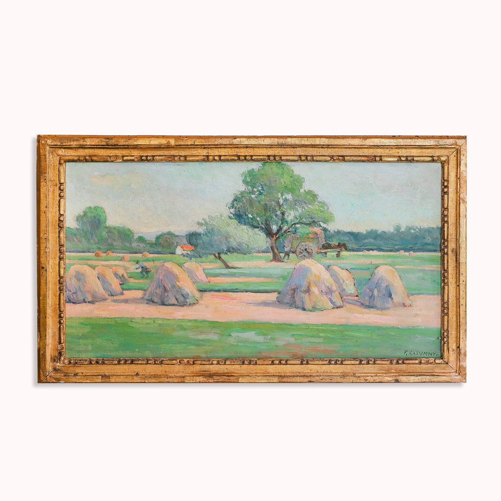 Vibrant antique French painting depicting a field with haystacks and figures working in the distance, available at Wildschut Antiques