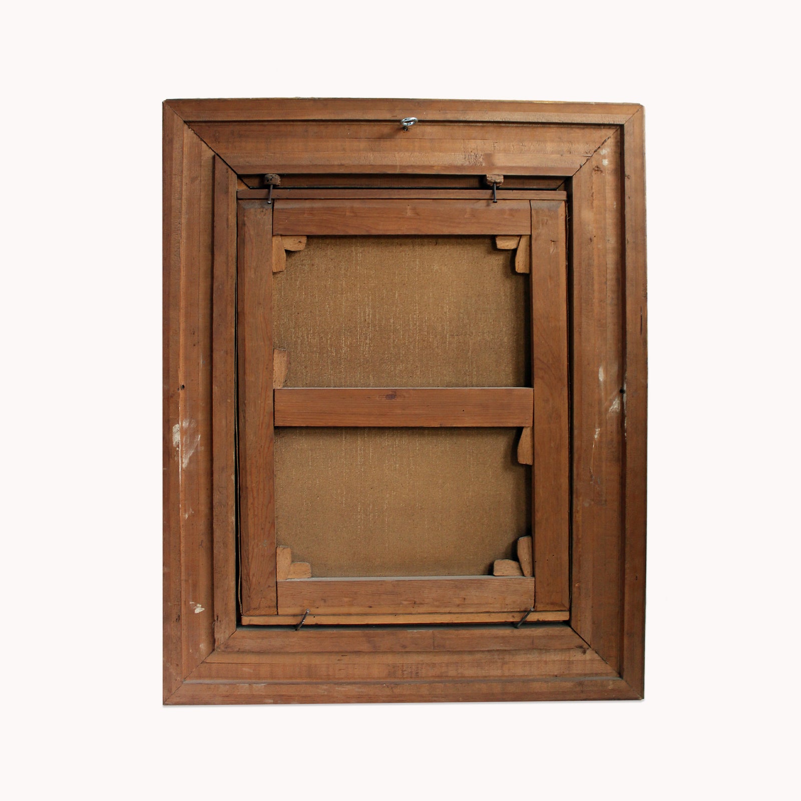 Backside of an antique oil portrait of a gentleman painted by W.N. Hendrikse, in a giltwood frame, set against a clear background.